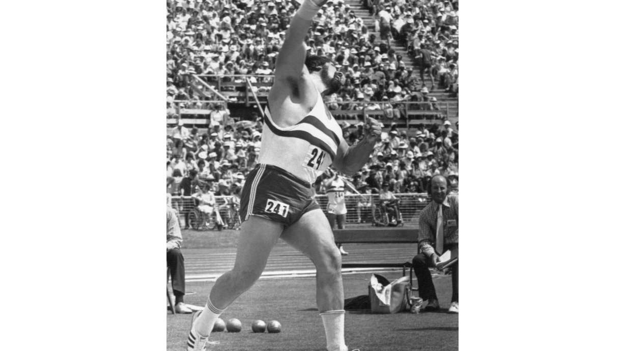 FILE - Geoff Capes of England throws the shot to win the fold medal in the men's shot put event at the Tenth Commonwealth Games, in the Queen Elizabeth II Park Stadium in Christchurch, New Zealand, Feb. 2, 1974.