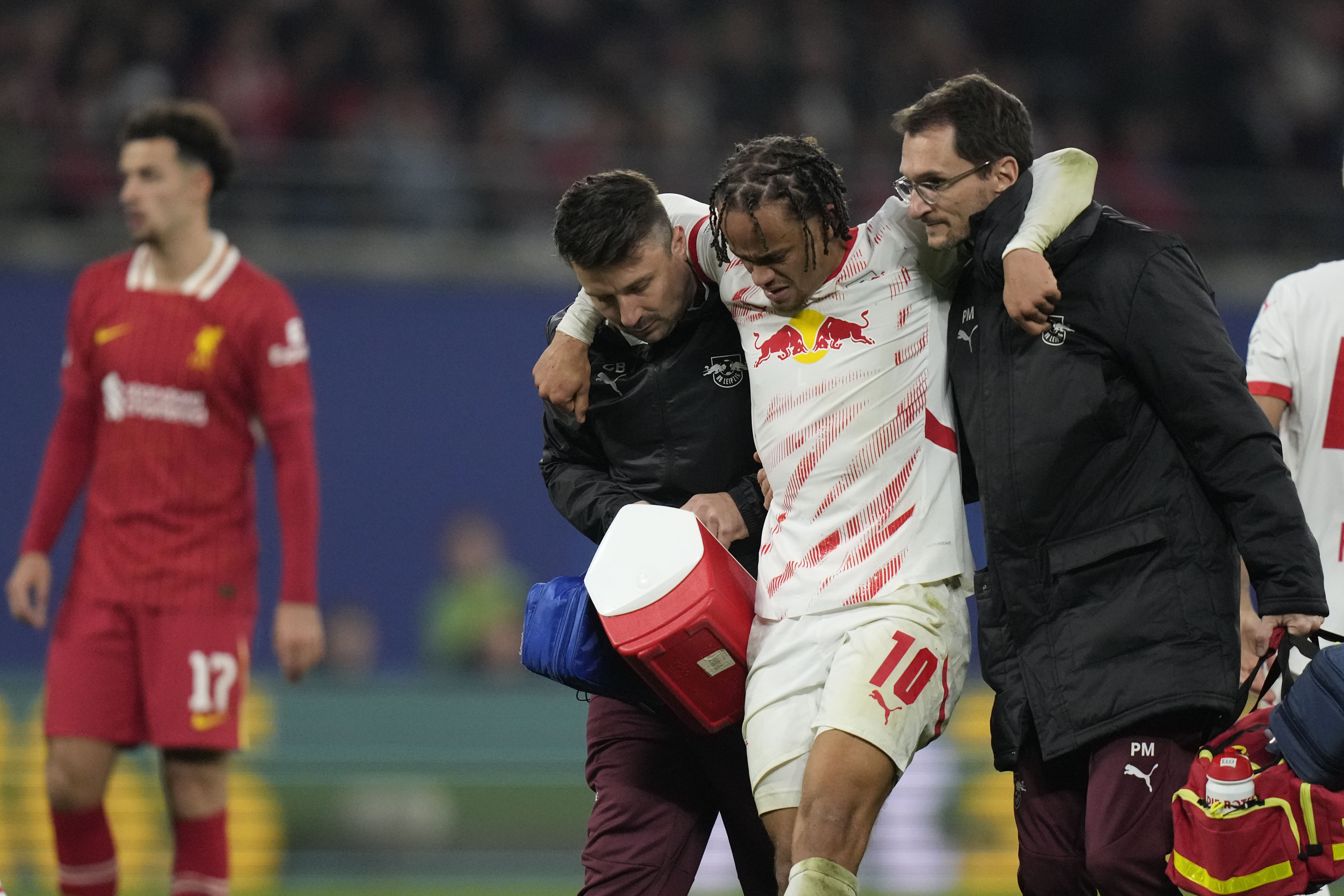 Leipzig's Xavi Simons leaves the field with medics during the Champions League opening phase soccer match between RB Leipzig and Liverpool at the RB Arena in Leipzig, Germany, Wednesday, Oct. 23, 2024.