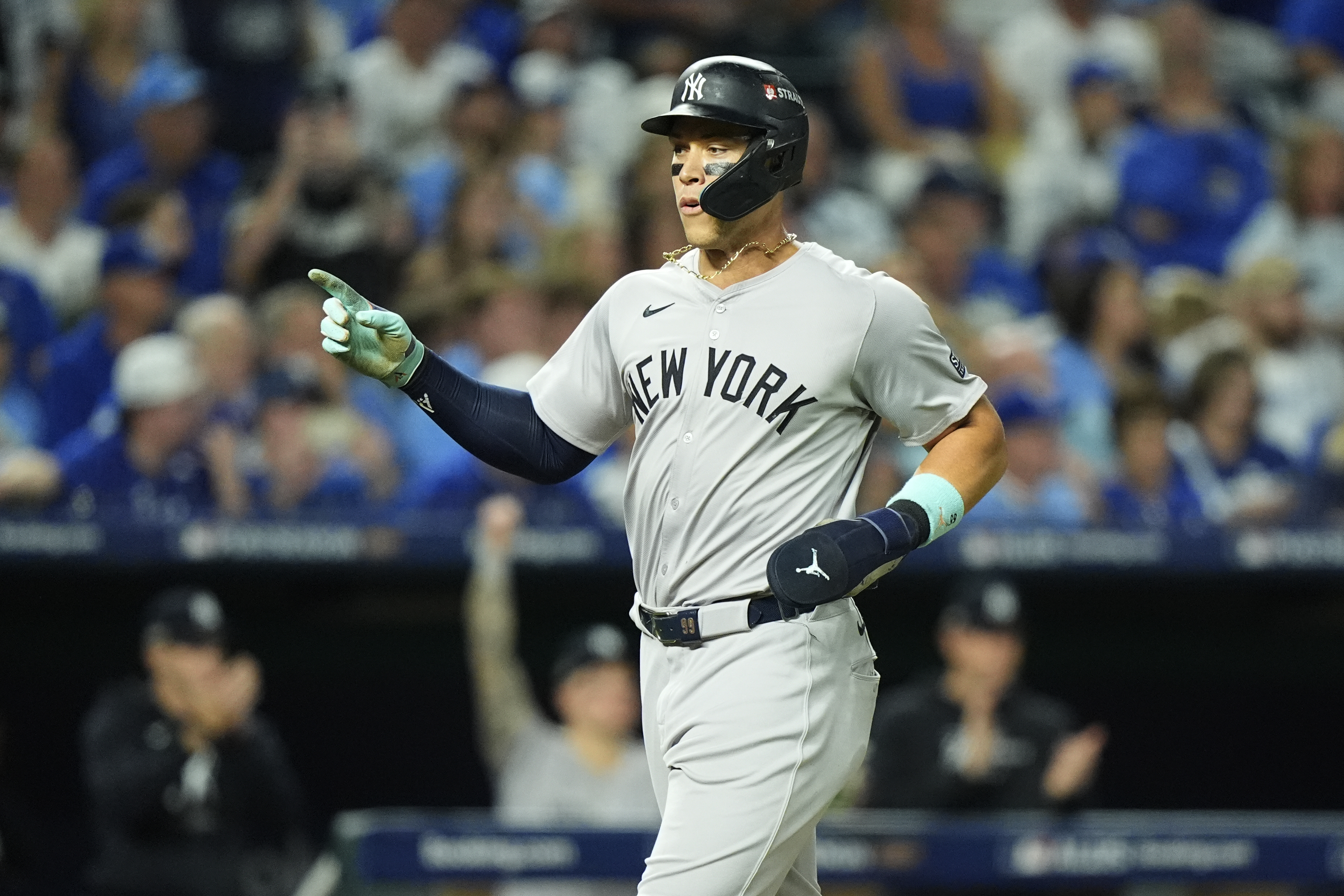 New York Yankees' Aaron Judge celebrates as he scores during the sixth inning in Game 4 of an American League Division baseball playoff series against the Kansas City Royals Thursday, Oct. 10, 2024, in Kansas City, Mo.