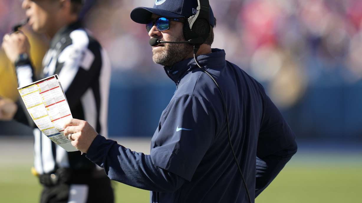 Tennessee Titans head coach Brian Callahan calls a play from the sideline during the first half of an NFL football game against the Buffalo Bills, Sunday, Oct. 20, 2024, in Orchard Park, N.Y.