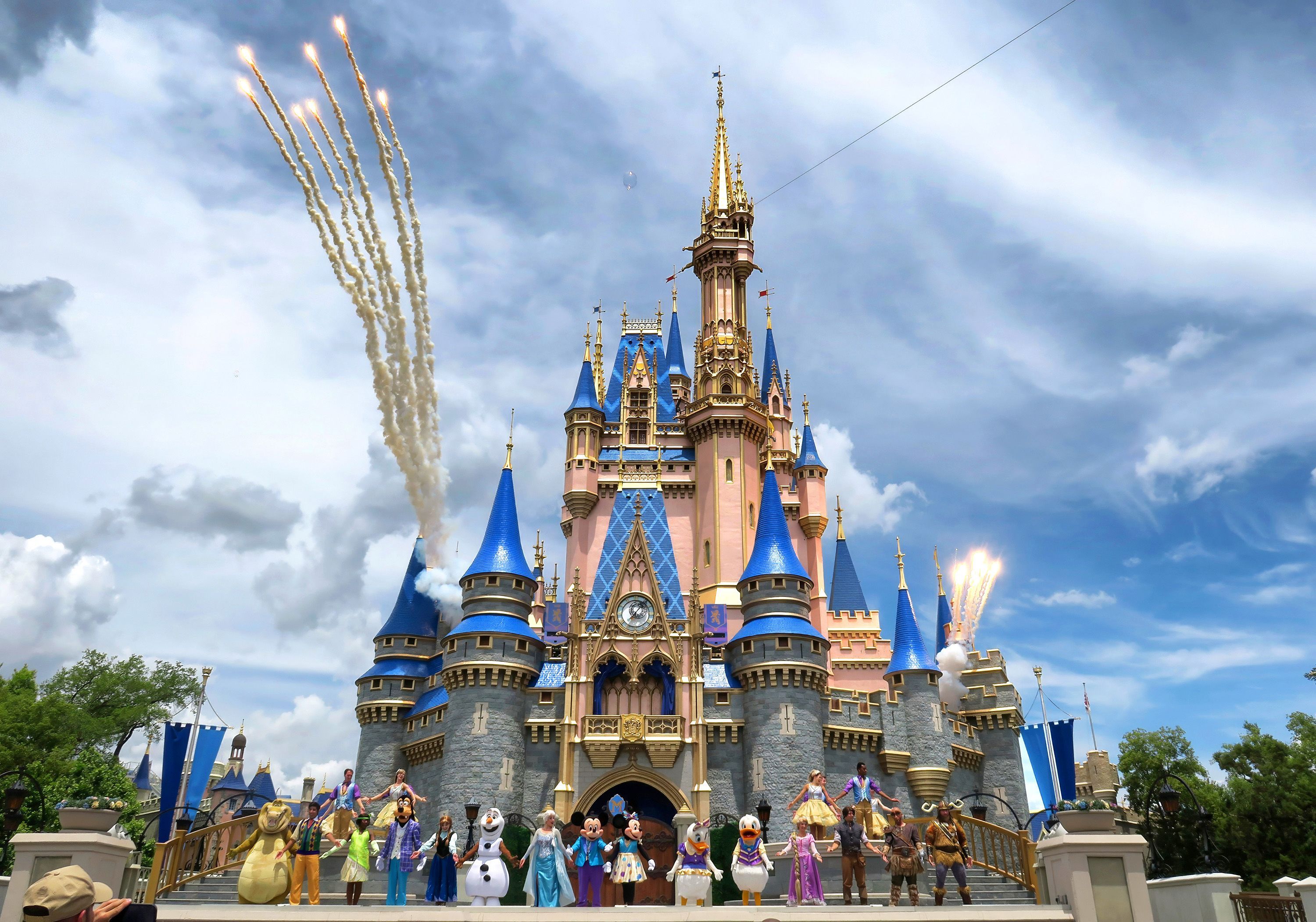 Daytime fireworks launch over Cinderella Castle in the Magic Kingdom at Walt Disney World on April 30. The park will increase its annual passes by up to $100.