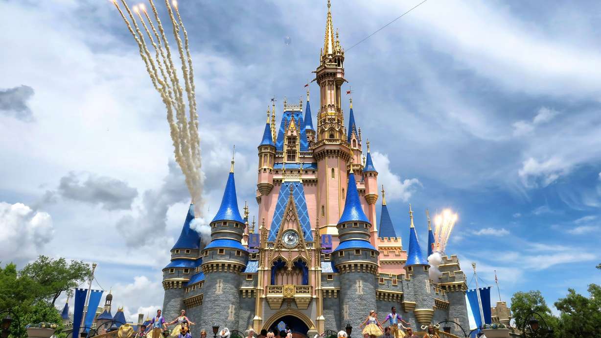 Daytime fireworks launch over Cinderella Castle in the Magic Kingdom at Walt Disney World on April 30. The park will increase its annual passes by up to $100.