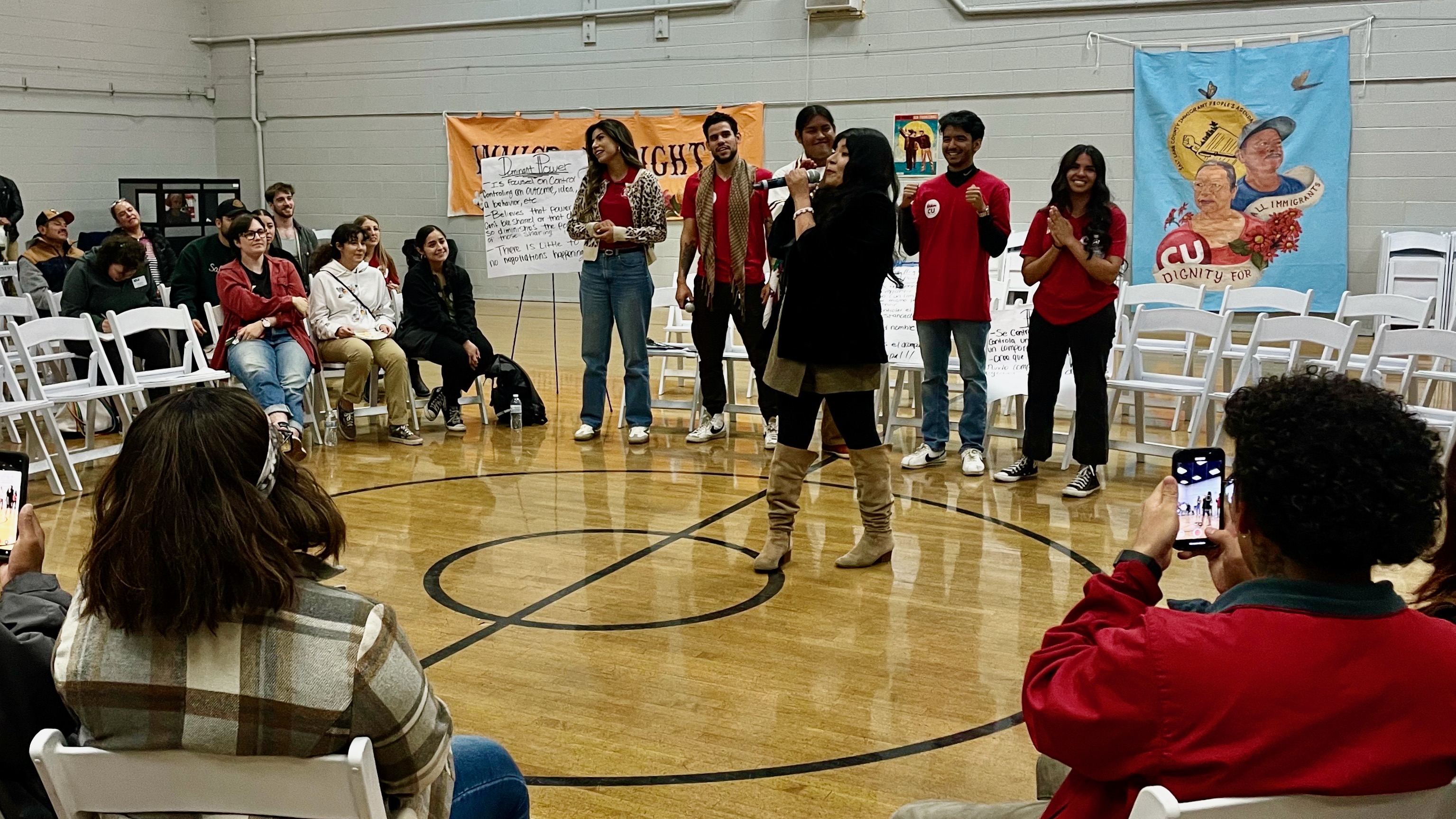 Mayra Cedano, center, the head of Comunidades Unidas, speaks at the Mexican Civic Center in Salt Lake City on Oct. 18. Her group promotes Latino participation in elections.