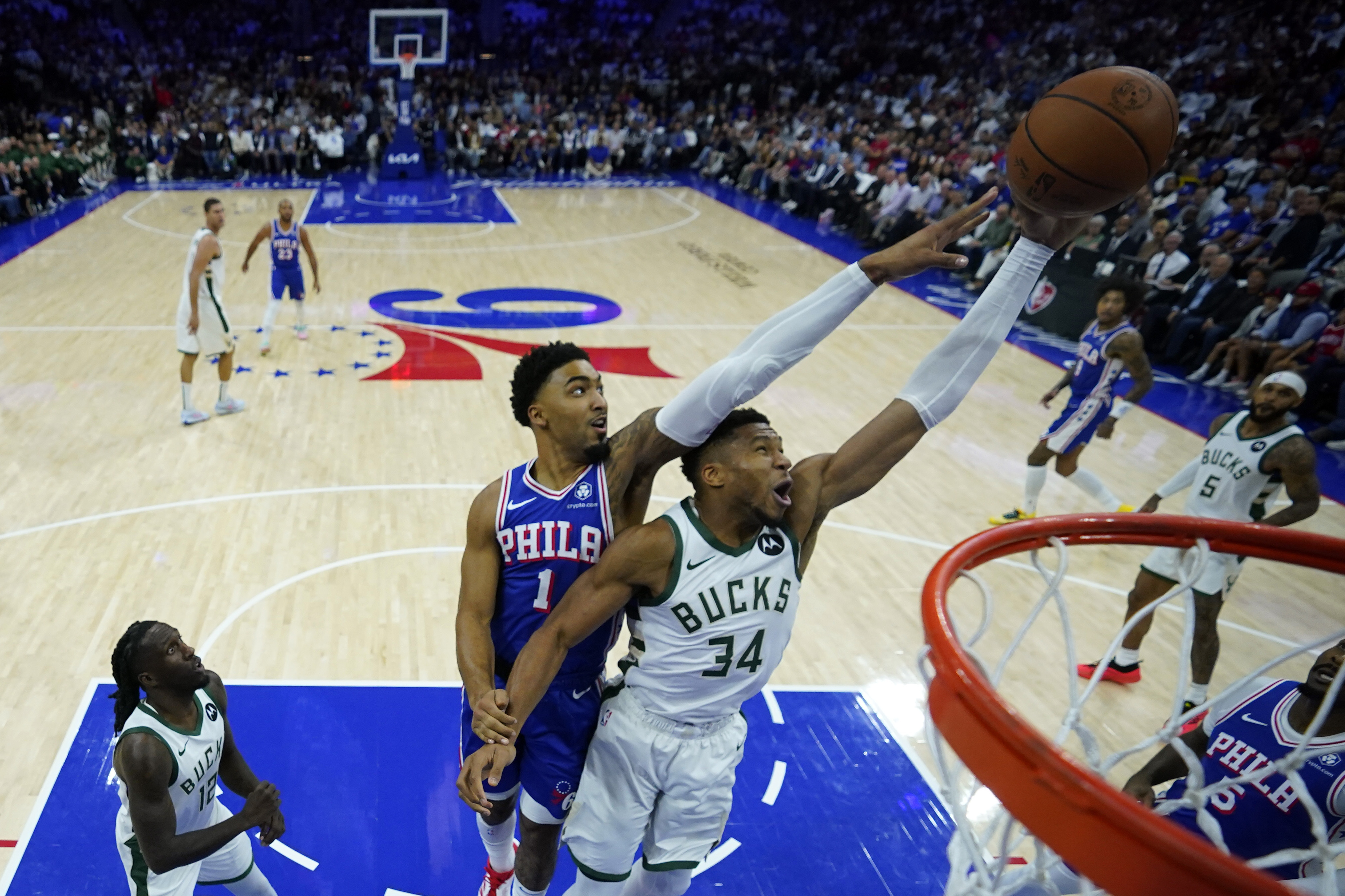 Lillard and Antetokounmpo power Bucks past short-handed 76ers 124-109