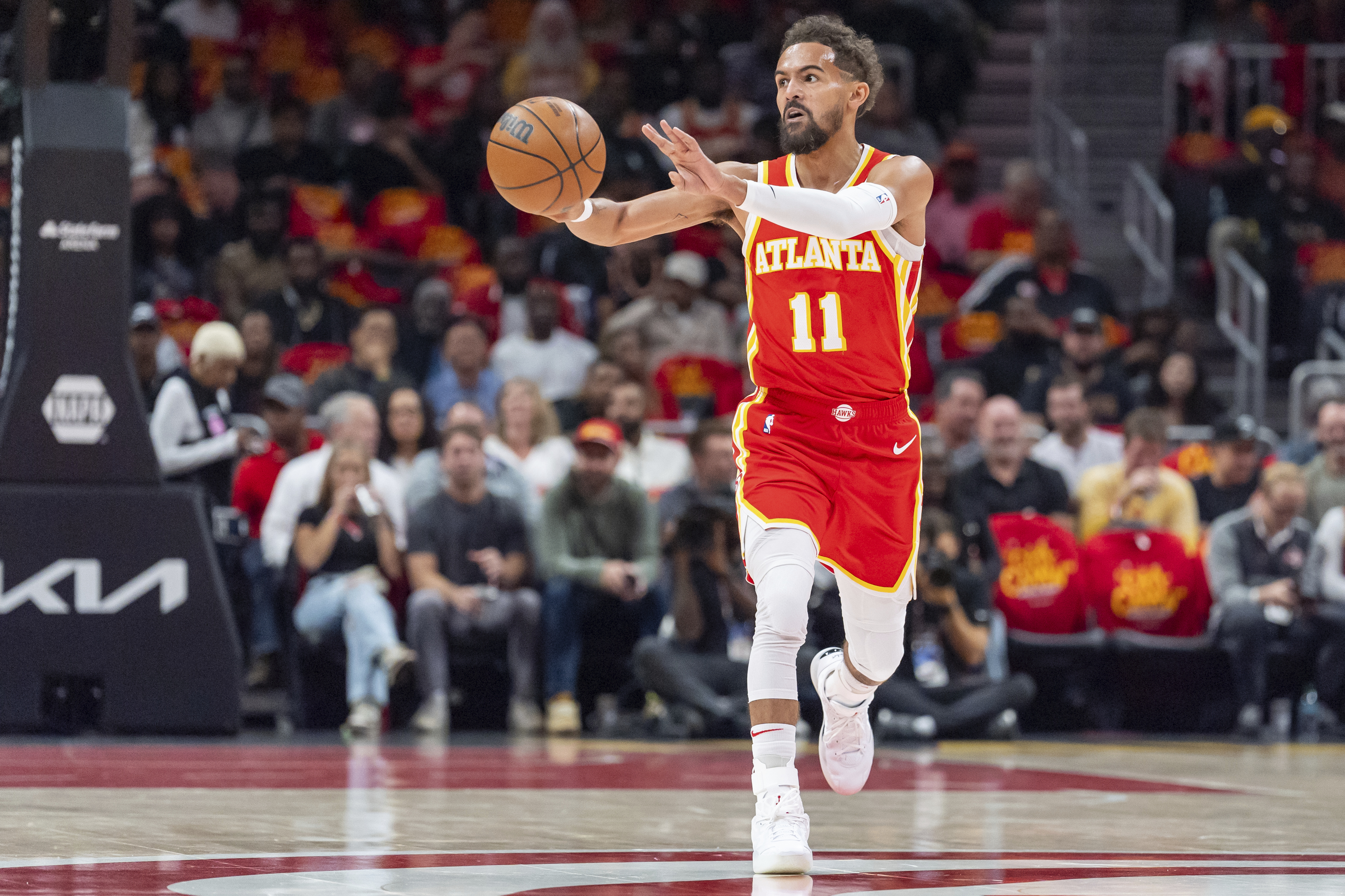 Atlanta Hawks guard Trae Young (11) passes the ball during the first half of an NBA basketball game against the Brooklyn Nets and Atlanta Hawks, Wednesday, Oct. 23, 2024, in Atlanta.