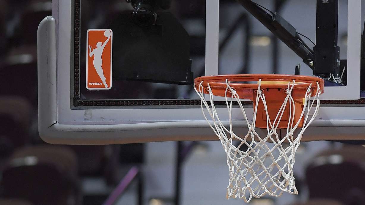 FILE - The WNBA logo and hoop are seen at a WNBA basketball game at Mohegan Sun Arena, Tuesday, May 14, 2019, in Uncasville, Conn.