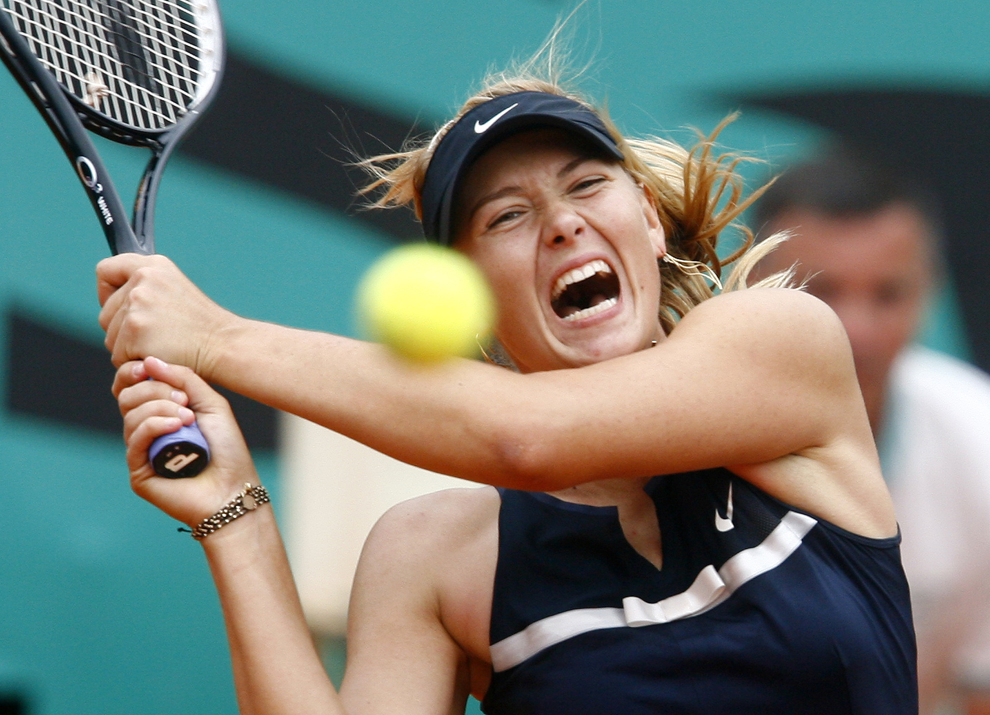 FILE - Russia's Maria Sharapova returns the ball to Italy's Karin Knapp during their third round match of the French Open tennis tournament at Roland Garros stadium in Paris, May 31, 2008.