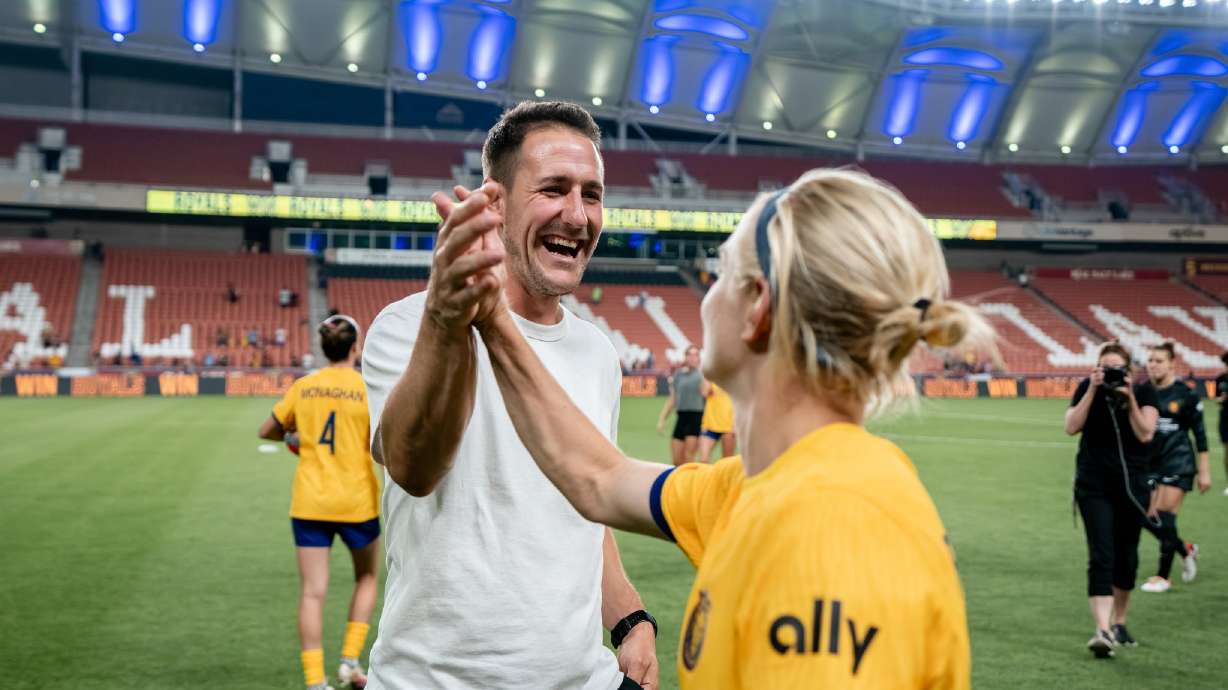Jimmy Coenraets, lefts, celebrates with Utah Royal Madison Pogarch, right.
