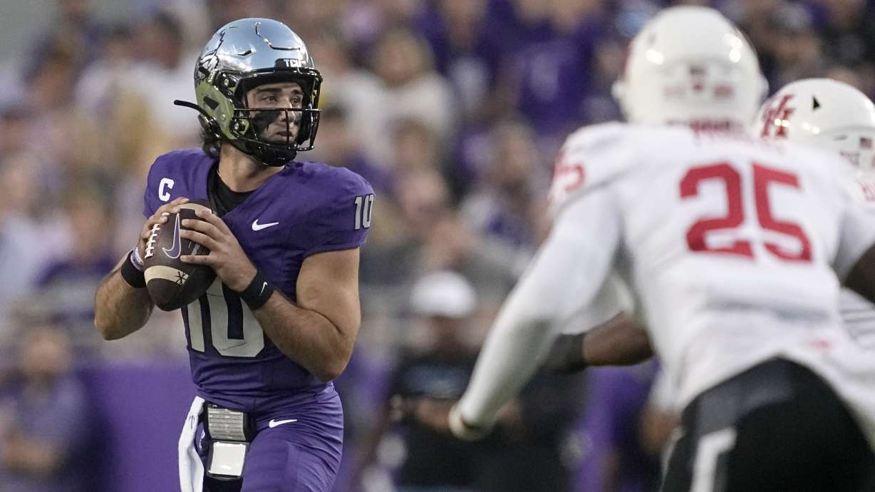 TCU quarterback Josh Hoover (10) drops back to pass as Houston linebacker Jamal Morris (25) rushes in the first half of an NCAA college football game Friday, Oct. 4, 2024, in Fort Worth, Texas.