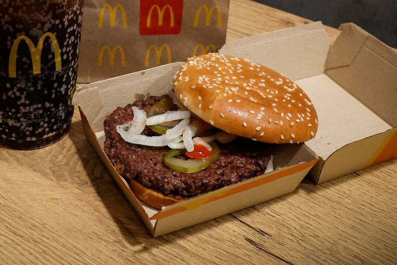 U.S. fast-food chains were pulling fresh onions out of their menu items on Thursday after the vegetable was named as the likely source of an E. coli outbreak at McDonald's restaurants.