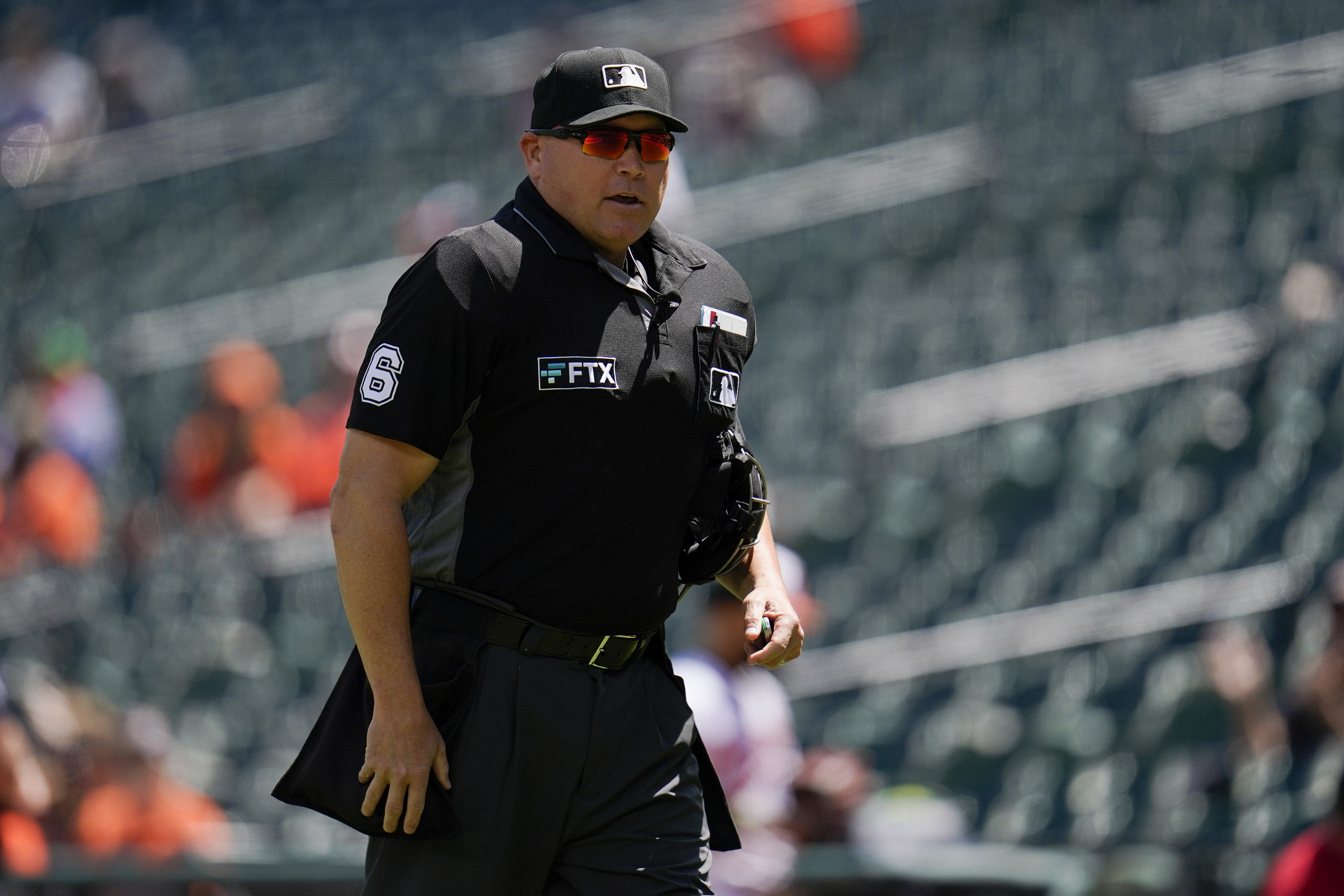 FILE - Home plate umpire Mark Carlson looks on during the first inning of a baseball game between the Baltimore Orioles and the Kansas City Royals, Monday, May 9, 2022, in Baltimore.