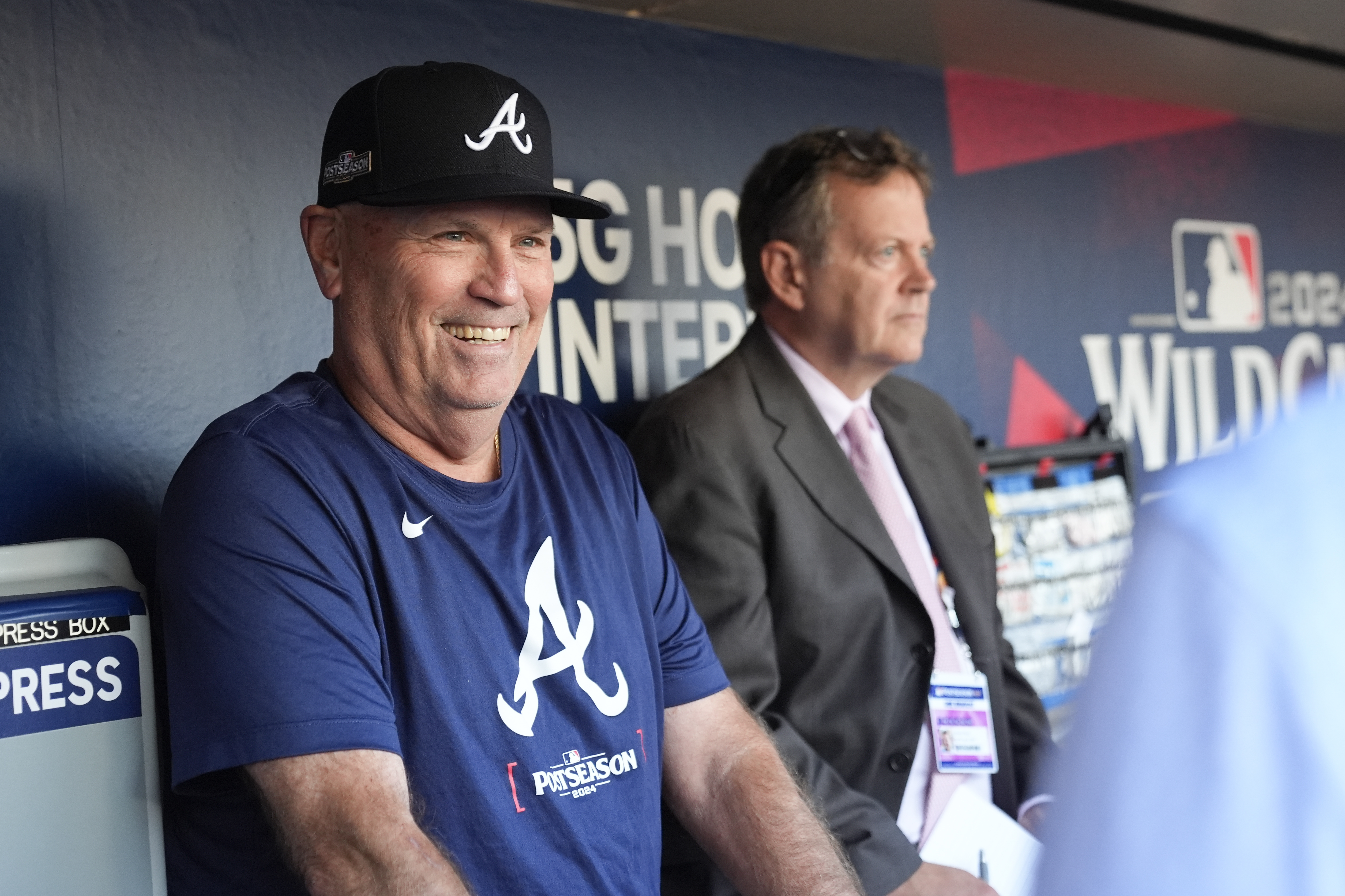 Atlanta Braves manager Brian Snitker talks to members of the press in the dugout before Game 2 of an NL Wild Card Series baseball game against the San Diego Padres, Wednesday, Oct. 2, 2024, in San Diego.