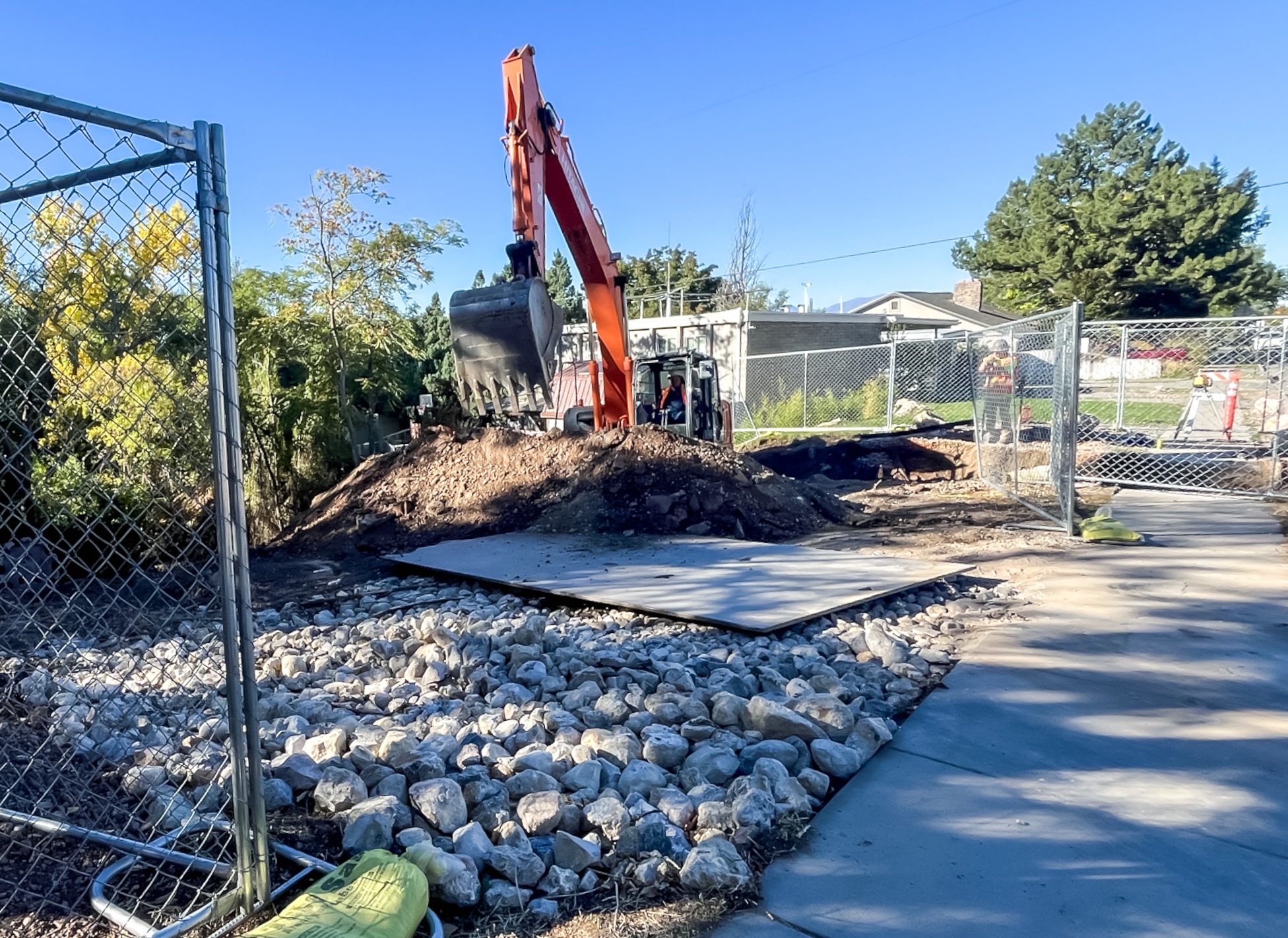 Construction crews work to remove an aging Emigration Creek culvert at 1700 South in Salt Lake City on Thursday.