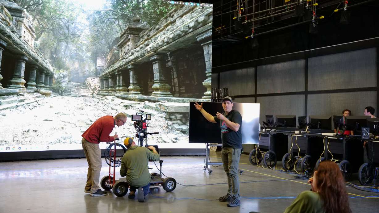 Jake Dickey, right, teaches Salt Lake Community College students how to use the latest technological advancement in Hollywood, called the virtual production stage.