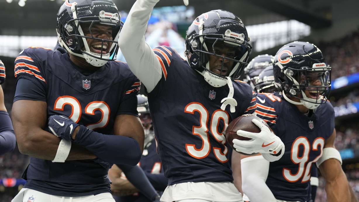Chicago Bears cornerback Josh Blackwell (39) celebrates with teammates after making an interception during an NFL football game at the Tottenham Hotspur stadium between the Jacksonville Jaguars and Chicago Bears in London, Sunday, Oct. 13, 2024.