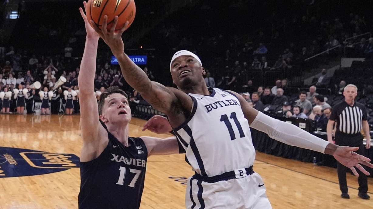 FILE - Butler's Jahmyl Telfort (11) drives against Xavier's Lazar Djokovic (17) during the first half of an NCAA college basketball game in the first round of the Big East basketball tournament March 13, 2024, in New York.