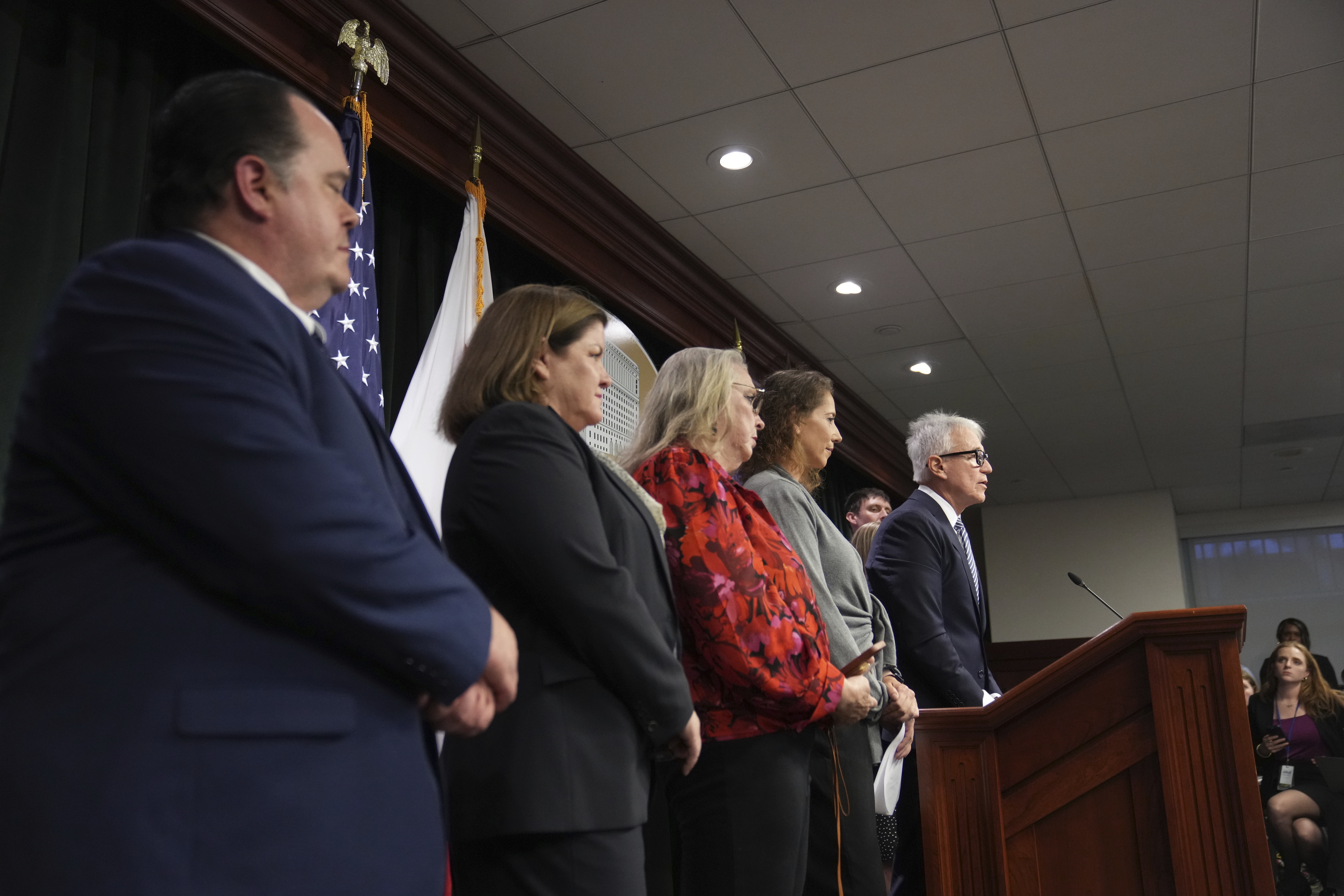 Los Angeles County District Attorney George Gascon, right, flanked by Menendez family members, speaks during a news conference at the Hall of Justice, Thursday in Los Angeles.