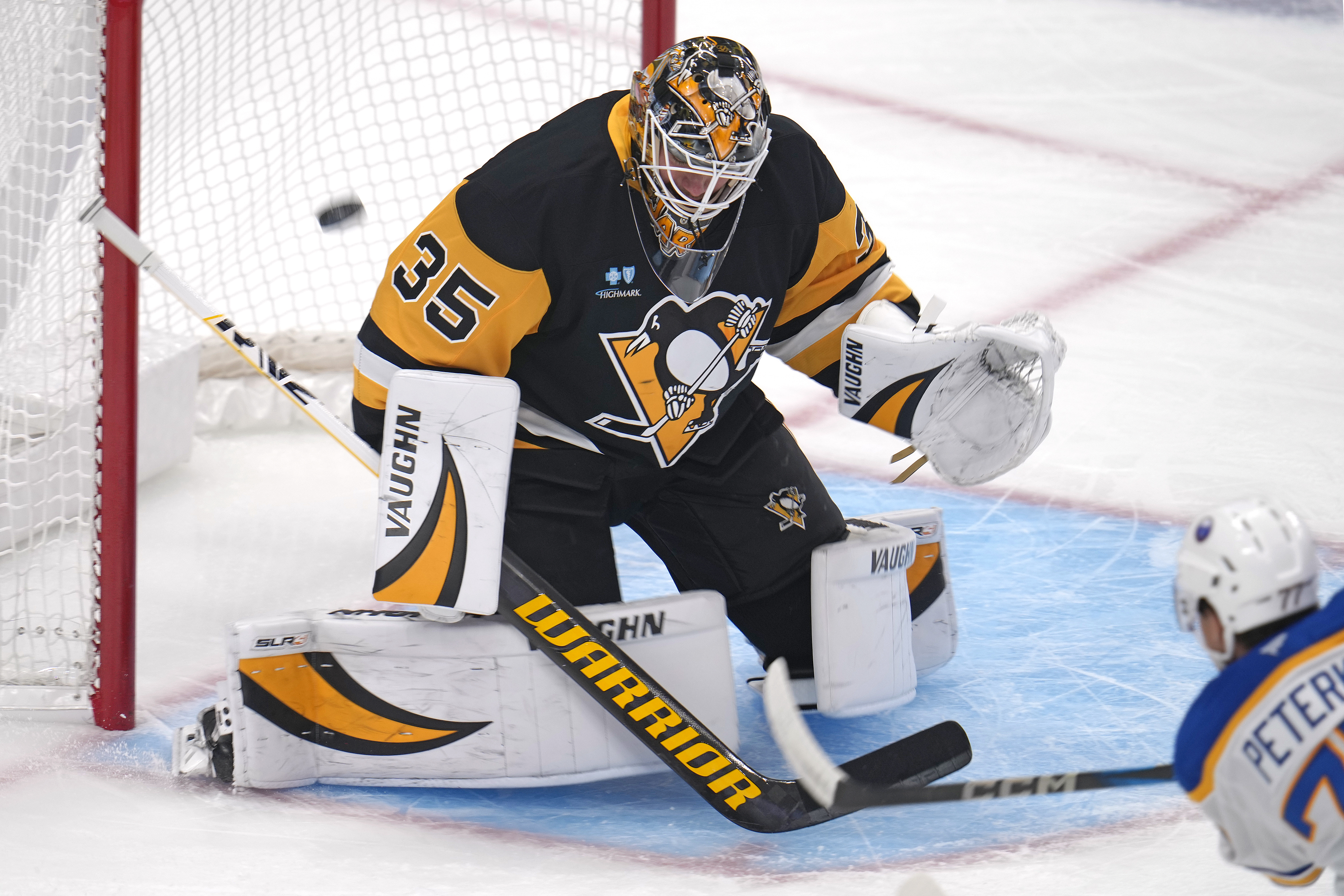 Buffalo Sabres' JJ Peterka, right, gets a shot behind Pittsburgh Penguins goaltender Tristan Jarry for a goal during the first period of an NHL hockey game in Pittsburgh, Wednesday, Oct. 16, 2024.