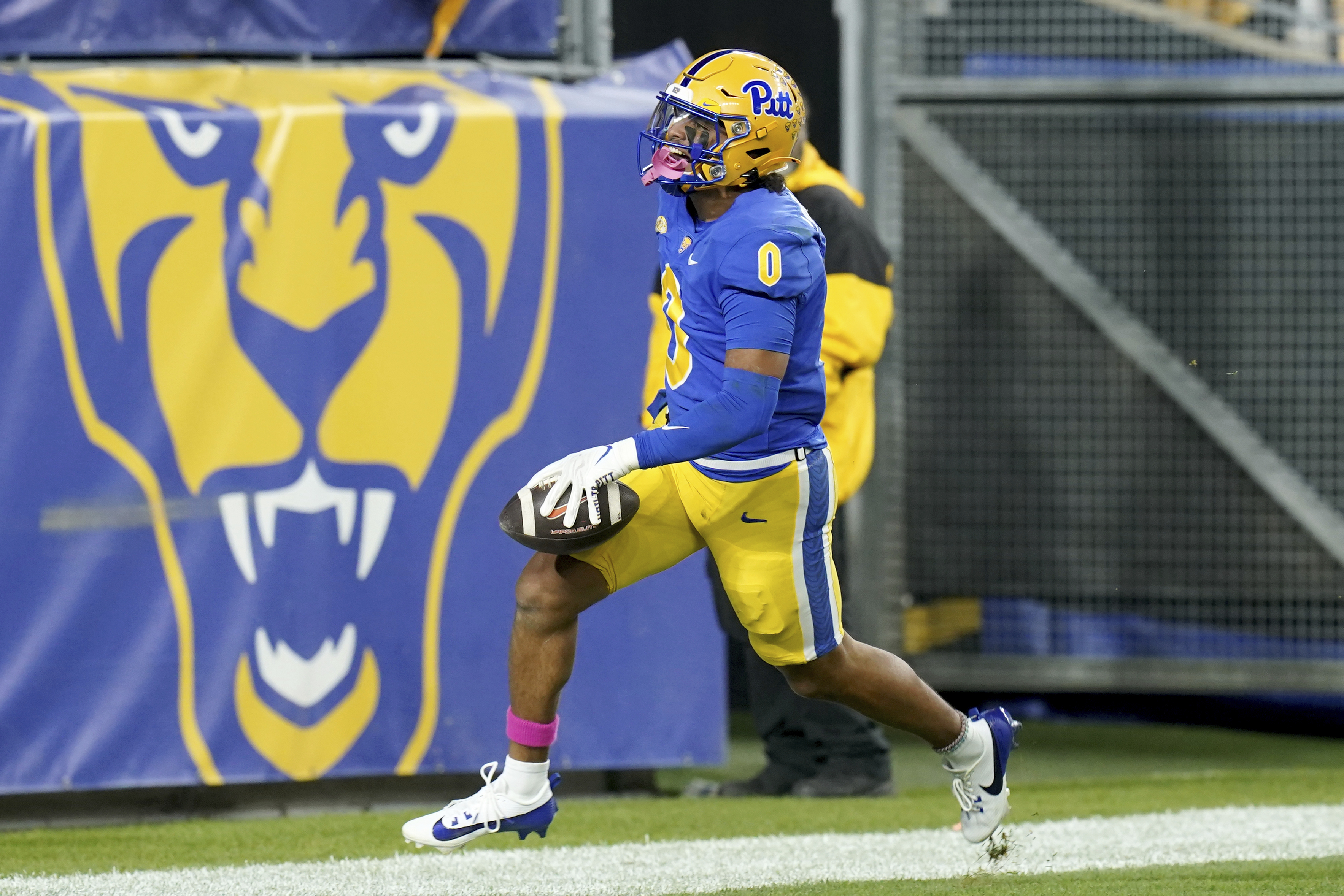Pittsburgh linebacker Braylan Lovelace celebrates after returning an interception for a touchdown during the first half of an NCAA college football game against Syracuse, Thursday, Oct. 24, 2024, in Pittsburgh.