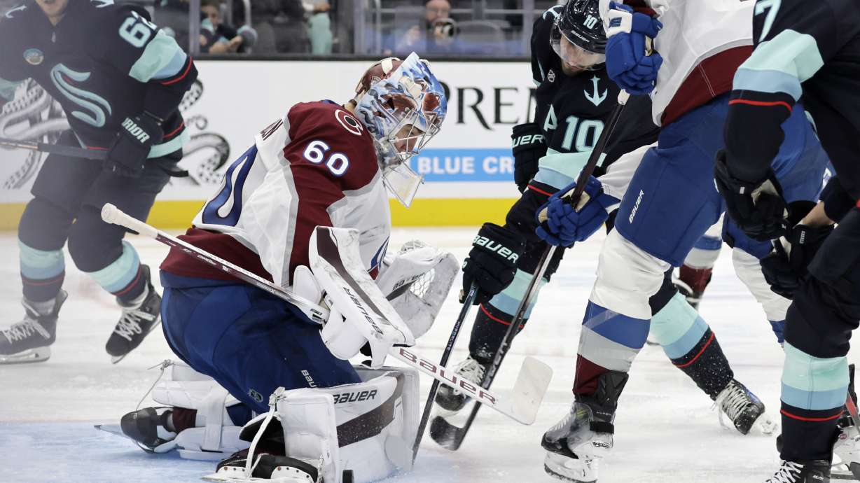 Colorado Avalanche goaltender Justus Annunen blocks the puck shot by Seattle Kraken center Matty Beniers (10) during the third period of an NHL hockey game, Tuesday, Oct. 22, 2024, in Seattle. The Avalanche won 3-2.