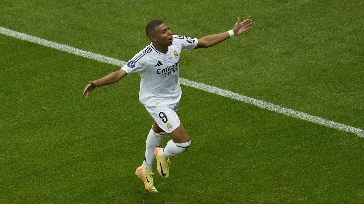 FILE - Real Madrid's Kylian Mbappe celebrates after scoring his side's second goal during the UEFA Super Cup Final soccer match between Real Madrid and Atalanta at the Narodowy stadium in Warsaw, Poland, Aug. 14, 2024.