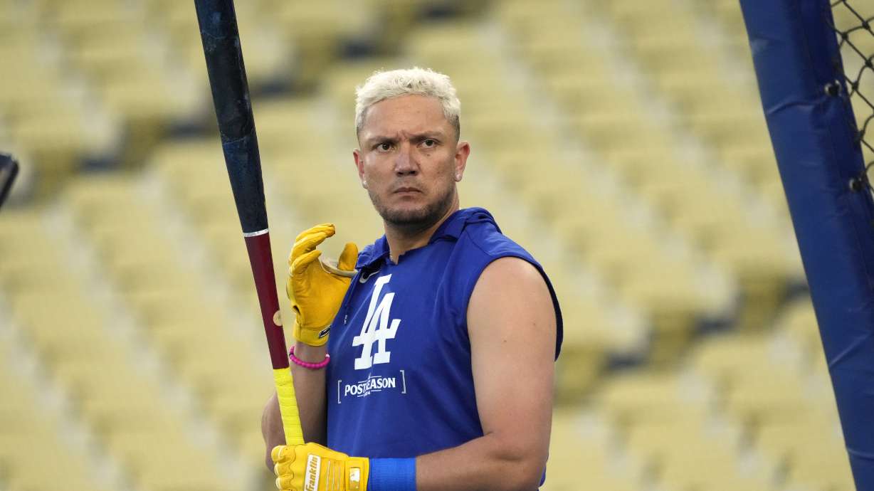 Los Angeles Dodgers' Miguel Rojas waits to bat during practice in preparation for Game 1 of a baseball NL Championship Series against the New York Mets, Saturday, Oct. 12, 2024, in Los Angeles.