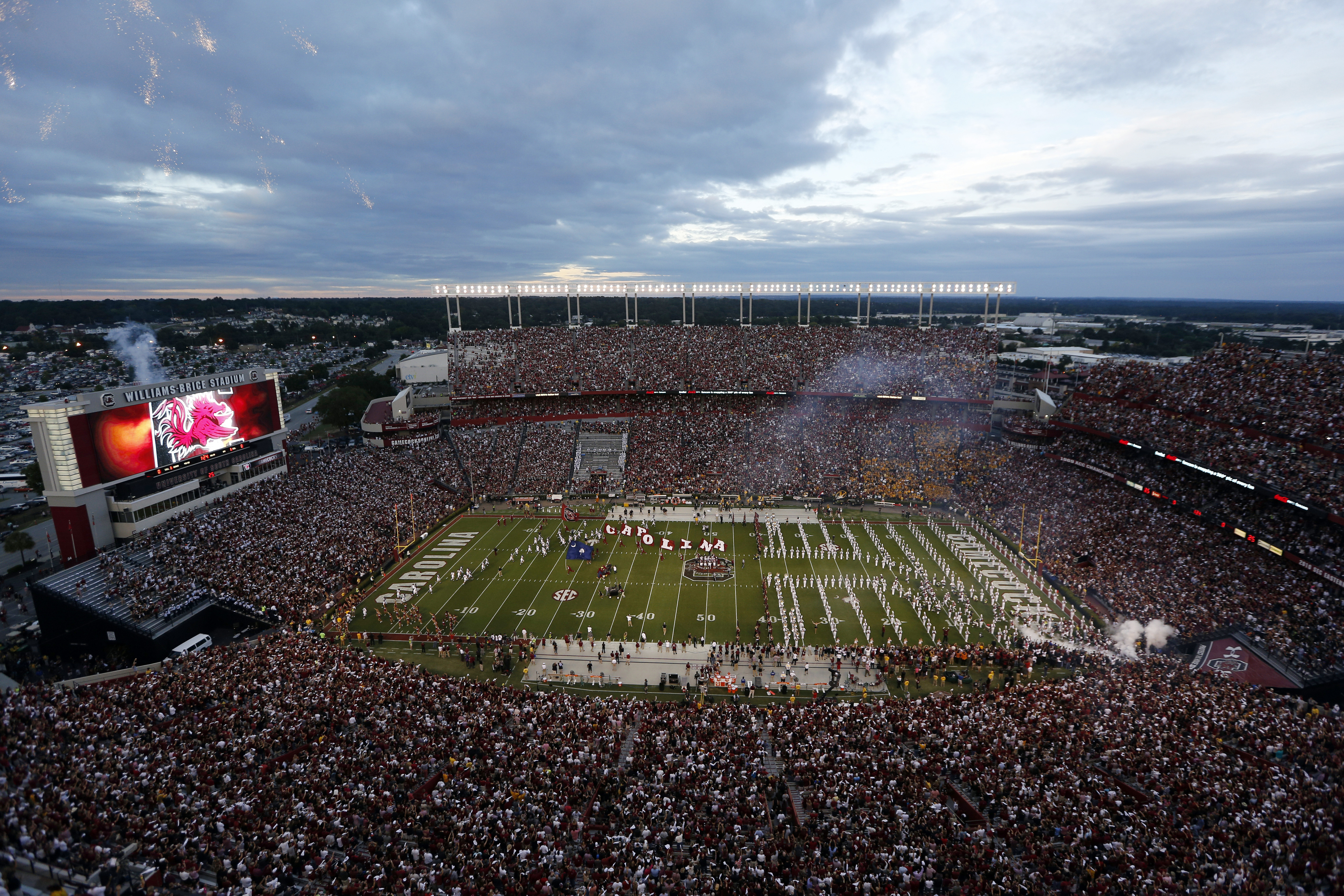 FILE - Fans cheer as South Carolina takes the field at Williams-Brice Stadium before the start of an NCAA college football game against Missouri, Sept. 27, 2014, in Columbia, S.C. 