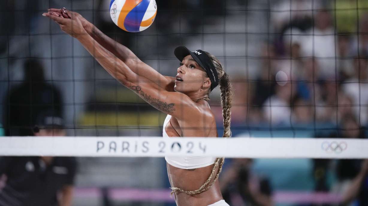 FILE - Canada's Brandie Wilkerson returns thea ball in the women's beach volleyball gold medal match between Brazil and Canada, at the 2024 Summer Olympics, Aug. 9, 2024, in Paris, France.