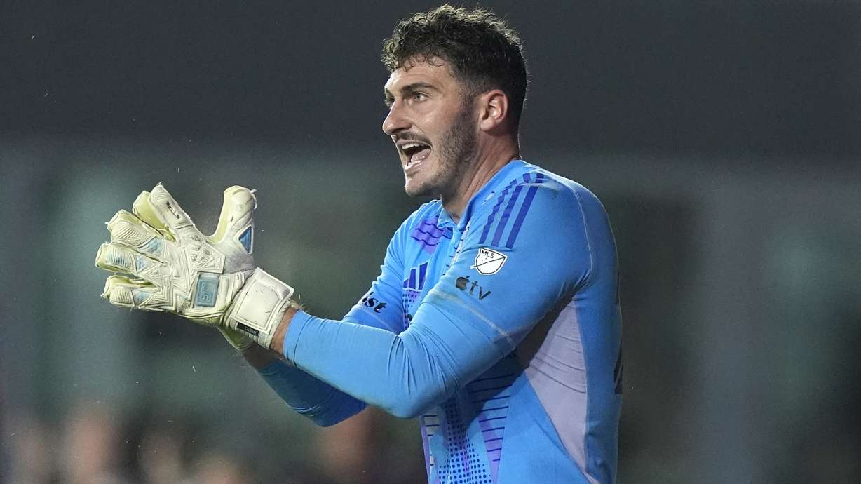 FILE - D.C. United goalkeeper Alex Bono encourages his team during the second half of an MLS soccer match against Inter Miami, Saturday, May 18, 2024, in Fort Lauderdale, Fla.
