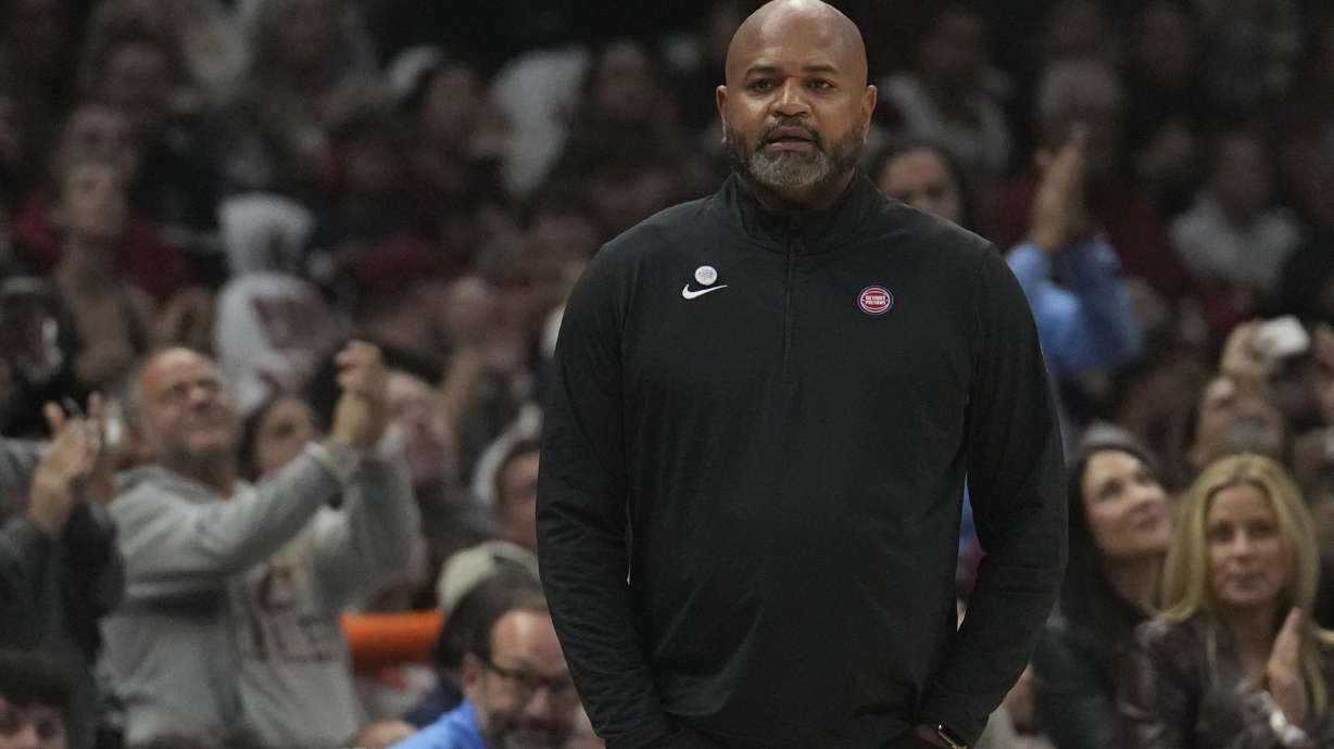 Detroit Pistons head coach J.B. Bickerstaff listens to a video tribute during a time out in the first half of an NBA basketball game against the Cleveland Cavaliers, where he coached the past five years, Friday, Oct. 25, 2024, in Cleveland.