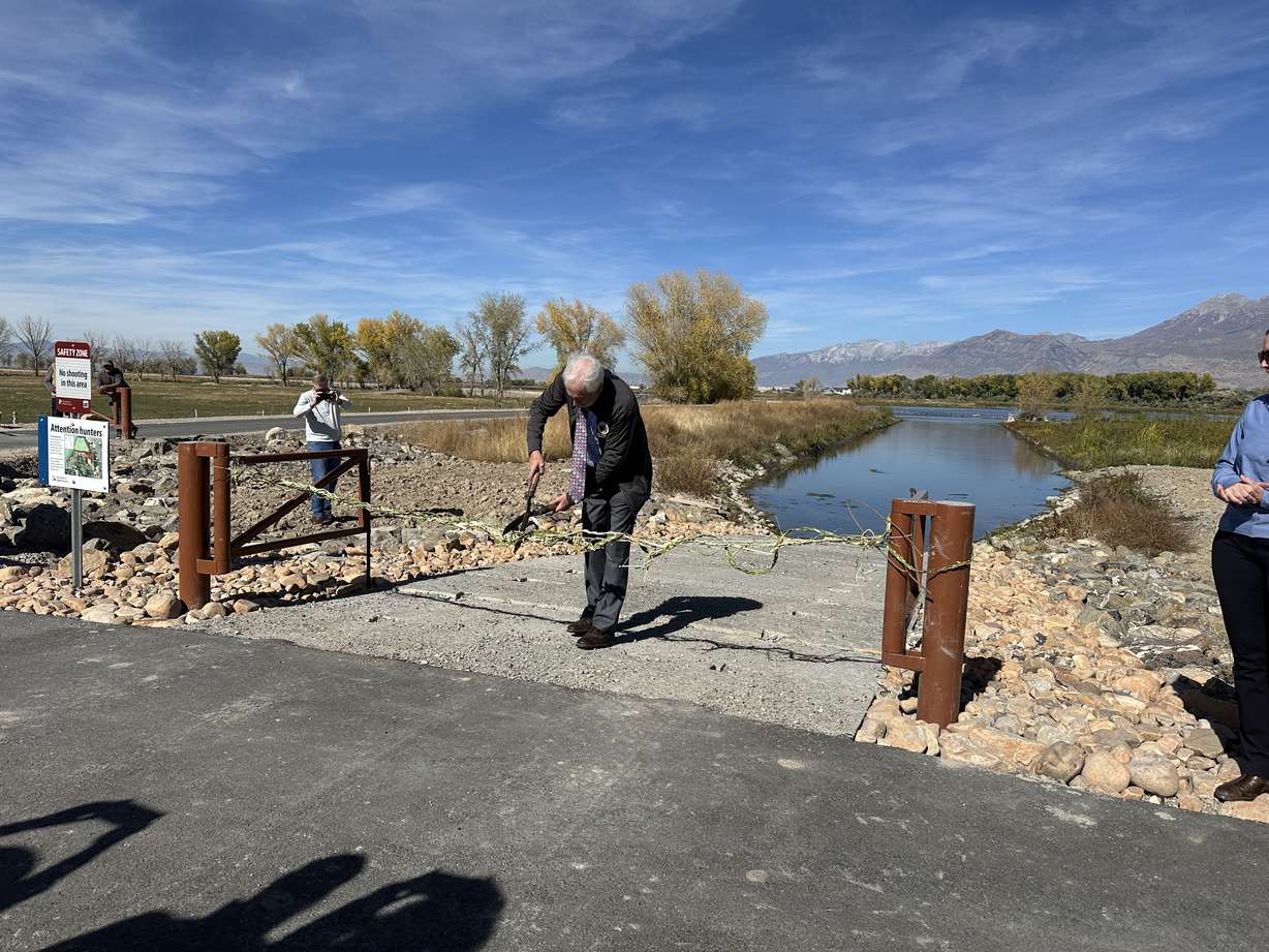 A ribbon is cut for the grand reopening of the Provo River Delta on Friday.