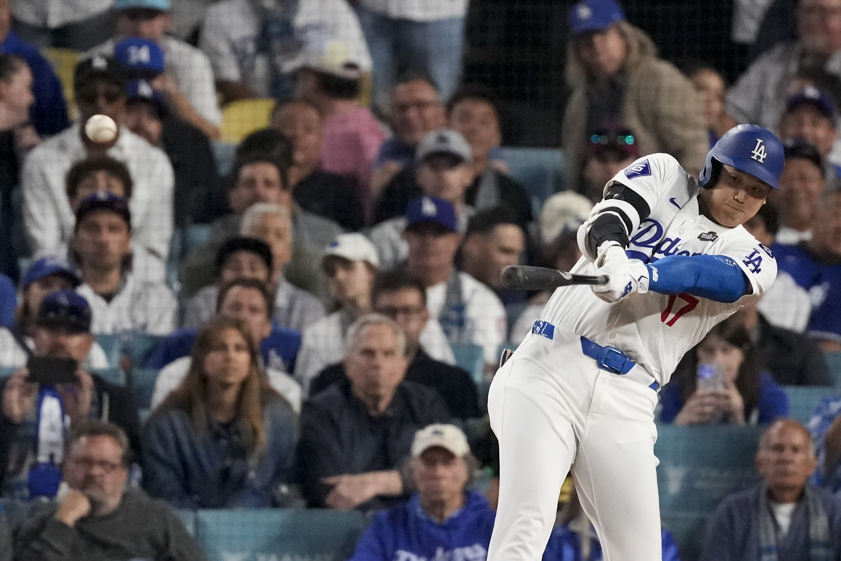 Los Angeles Dodgers' Shohei Ohtani connects for a double during the eighth inning in Game 1 of the baseball World Series against the New York Yankees, Friday, Oct. 25, 2024, in Los Angeles.