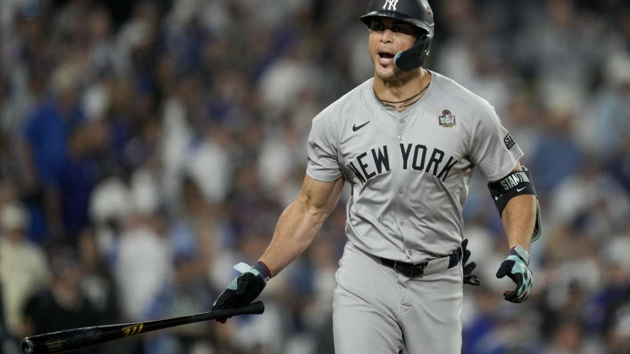 New York Yankees' Giancarlo Stanton celebrates his two-run home run against the Los Angeles Dodgers during the sixth inning in Game 1 of the baseball World Series, Friday, Oct. 25, 2024, in Los Angeles.
