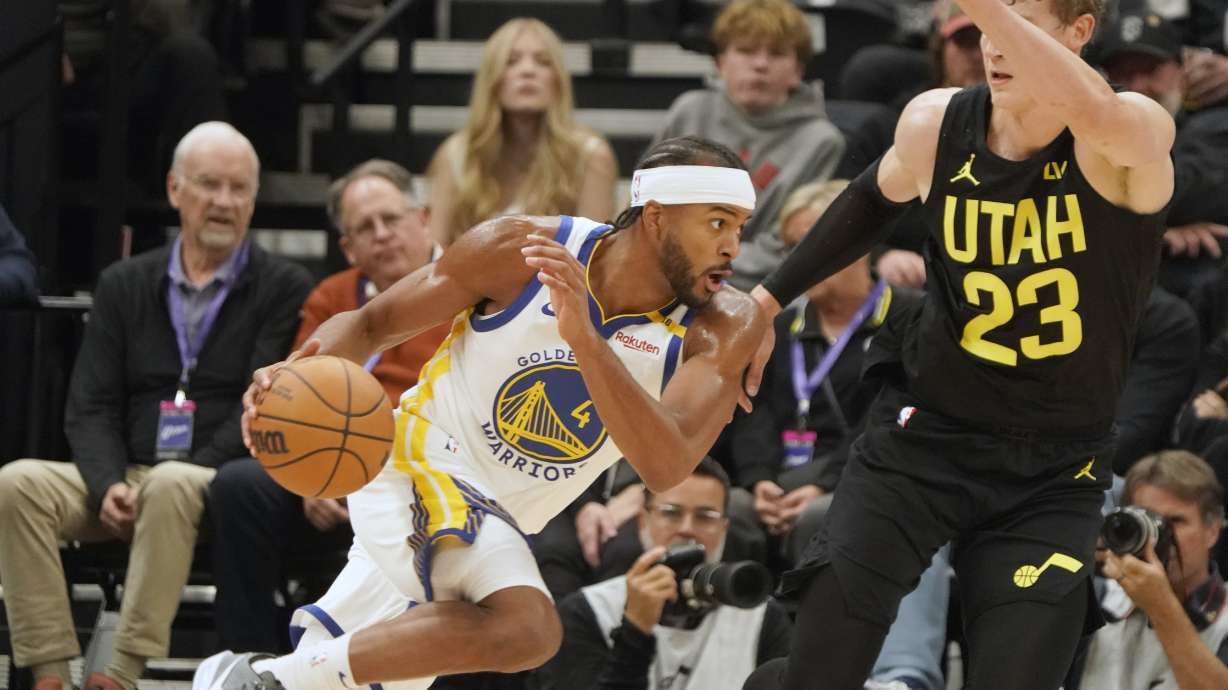 Golden State Warriors guard Moses Moody (4) drives against Utah Jazz forward Lauri Markkanen (23) in the first half of an NBA basketball game Friday, Oct. 25, 2024, in Salt Lake City.