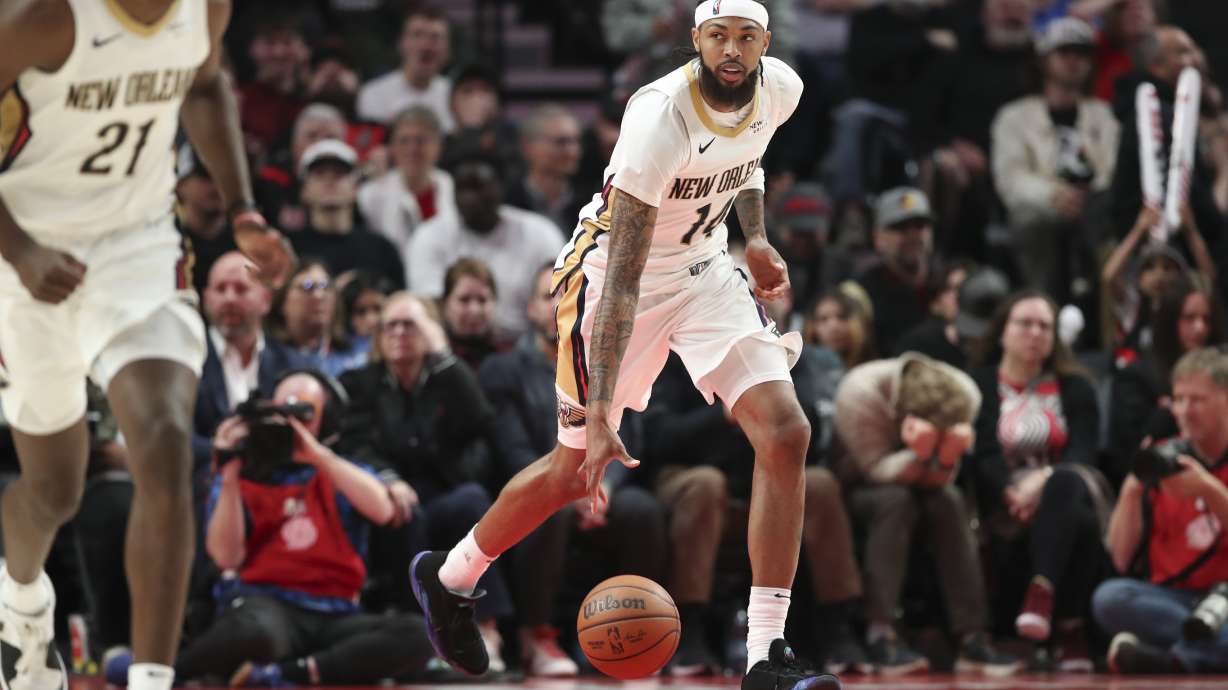 New Orleans Pelicans forward Brandon Ingram (14) brings the ball up court against the Portland Trail Blazers during the second half of an NBA basketball game Friday, Oct. 25, 2024, in Portland, Ore. The Pelicans won 105-103.