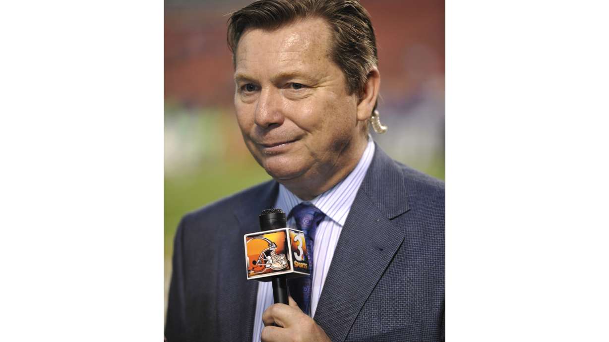 FILE _ Cleveland Browns radio broadcaster Jim Donovan stands on the field prior to an NFL football game against the Buffalo Bills on Thursday, Oct. 3, 2013 in Cleveland. The Browns won 37-24.