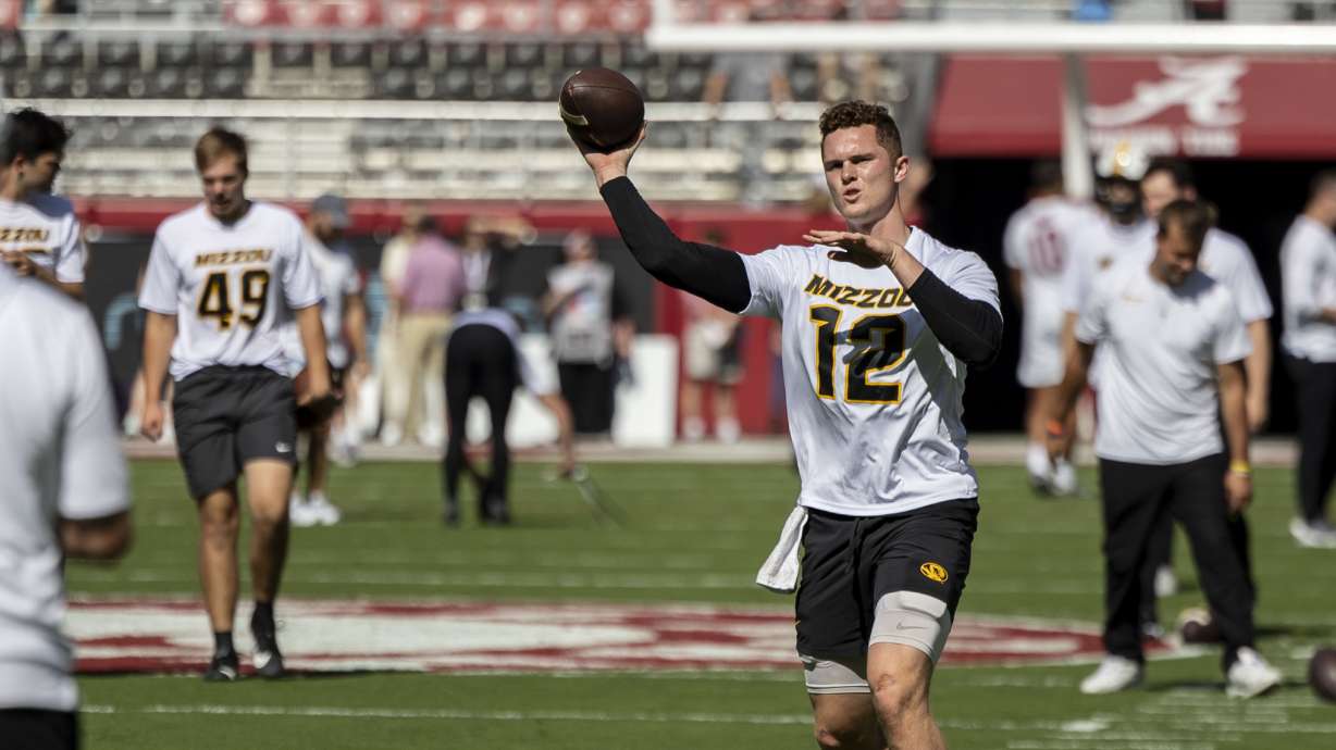 Missouri quarterback Brady Cook warms up before an NCAA college football game against Alabama, Saturday, Oct. 26, 2024, in Tuscaloosa, Ala.