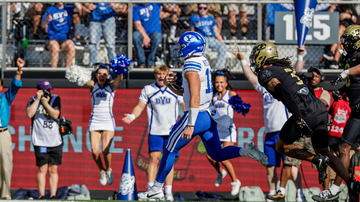 BYU quarterback Jake Retzlaff celebrates as he scores a rushing touchdown against UCF, Saturday, Oct. 26, 2024 at FBC Mortgage Stadium in Orlando, Florida.