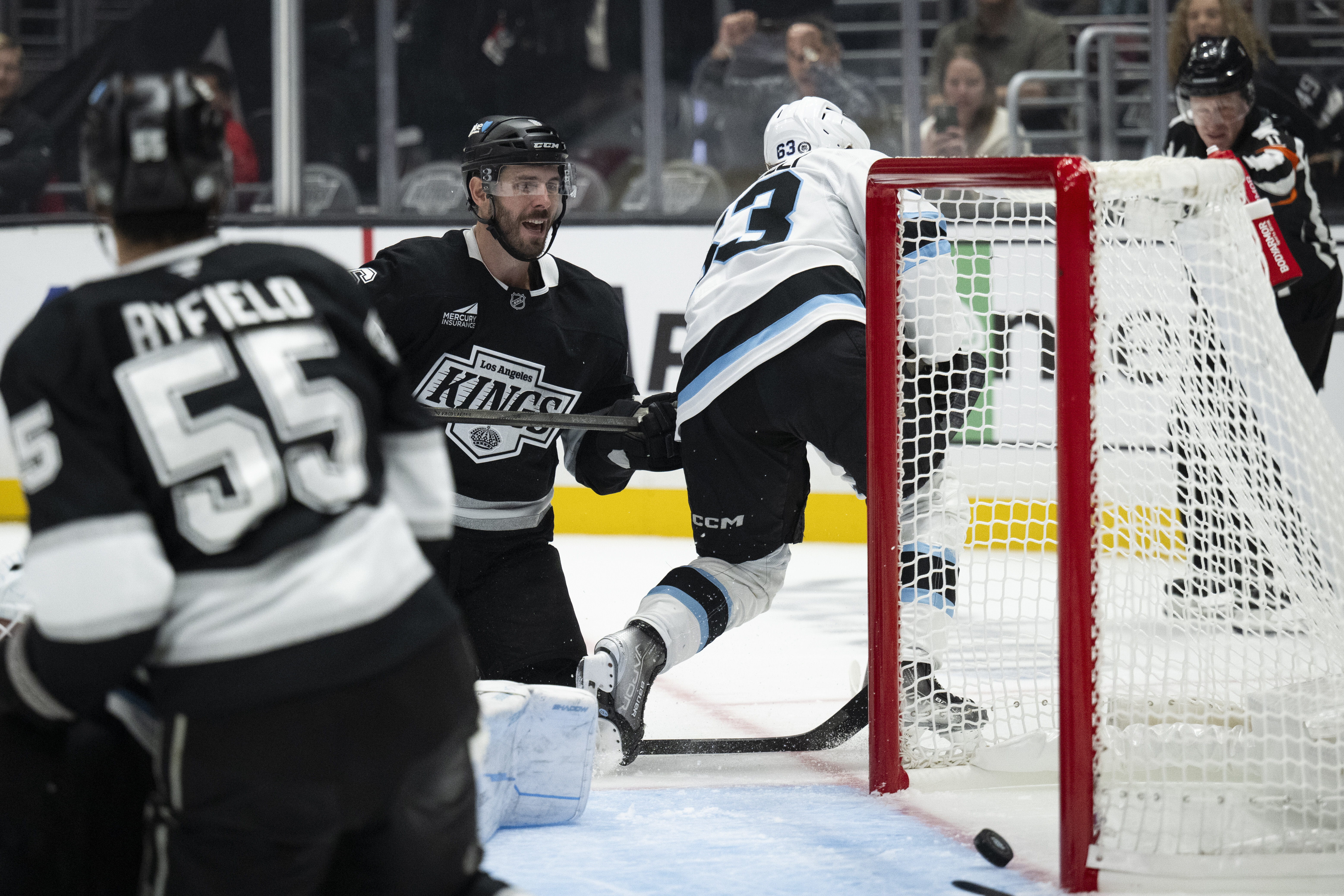 Los Angeles Kings defenseman Joel Edmundson (6) scores a goal past Utah Hockey Club left wing Matias Maccelli (63) during the second period of an NHL hockey game, Saturday, Oct. 26, 2024, in Los Angeles. 