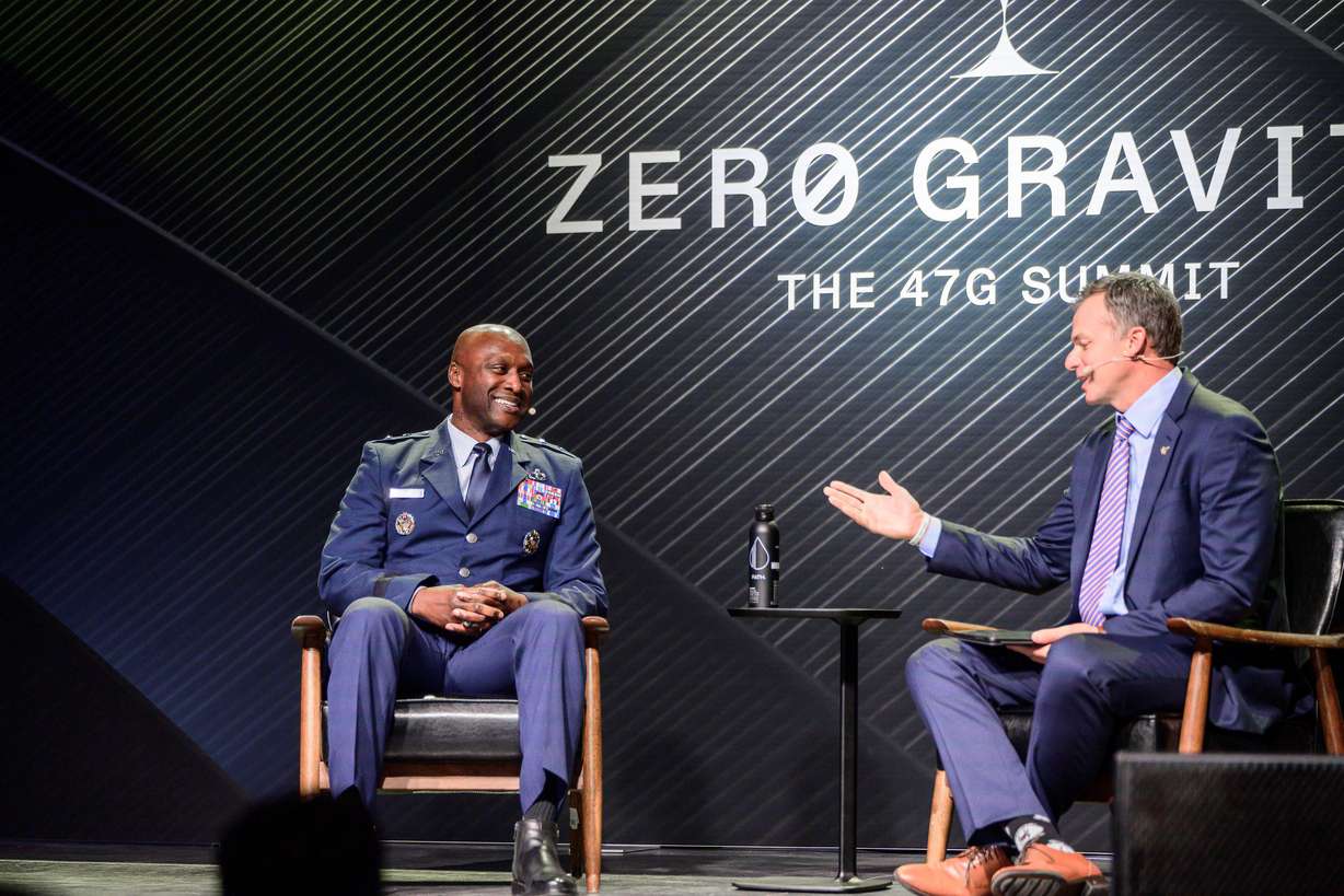 Maj. Gen. Kenyon Bell discusses national security with Rep. Blake Moore at the Zero Gravity Summit in Salt Lake City on Thursday.