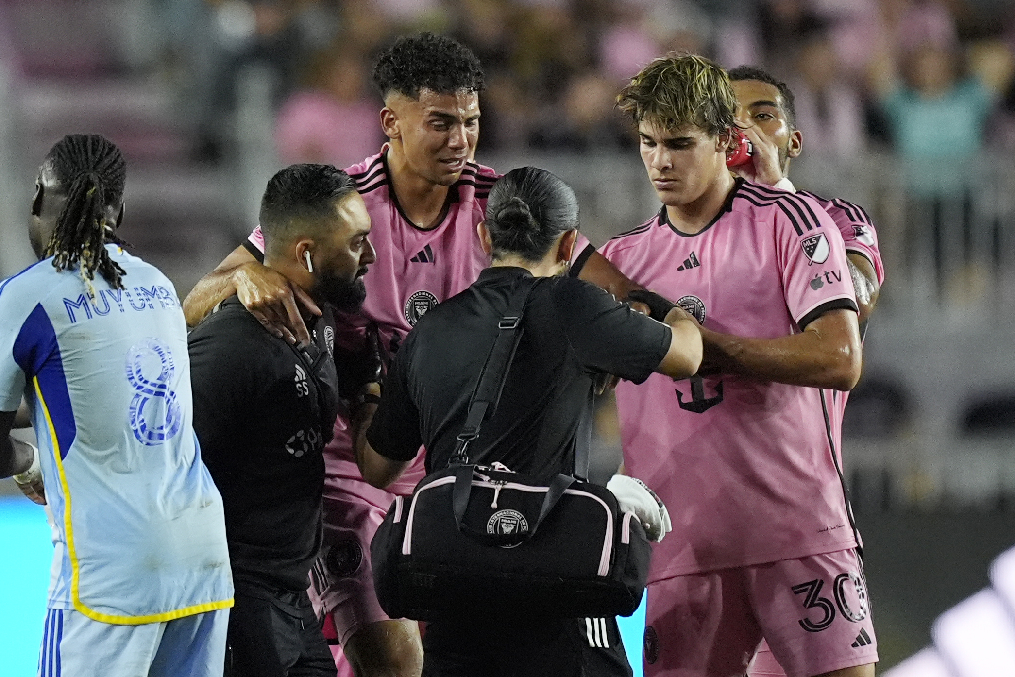 Inter Miami defender Ian Fray (17) is assisted off the field after he was injured during the second half of their MLS playoff opening round soccer match against Atlanta United, Friday, Oct. 25, 2024, in Fort Lauderdale, Fla.