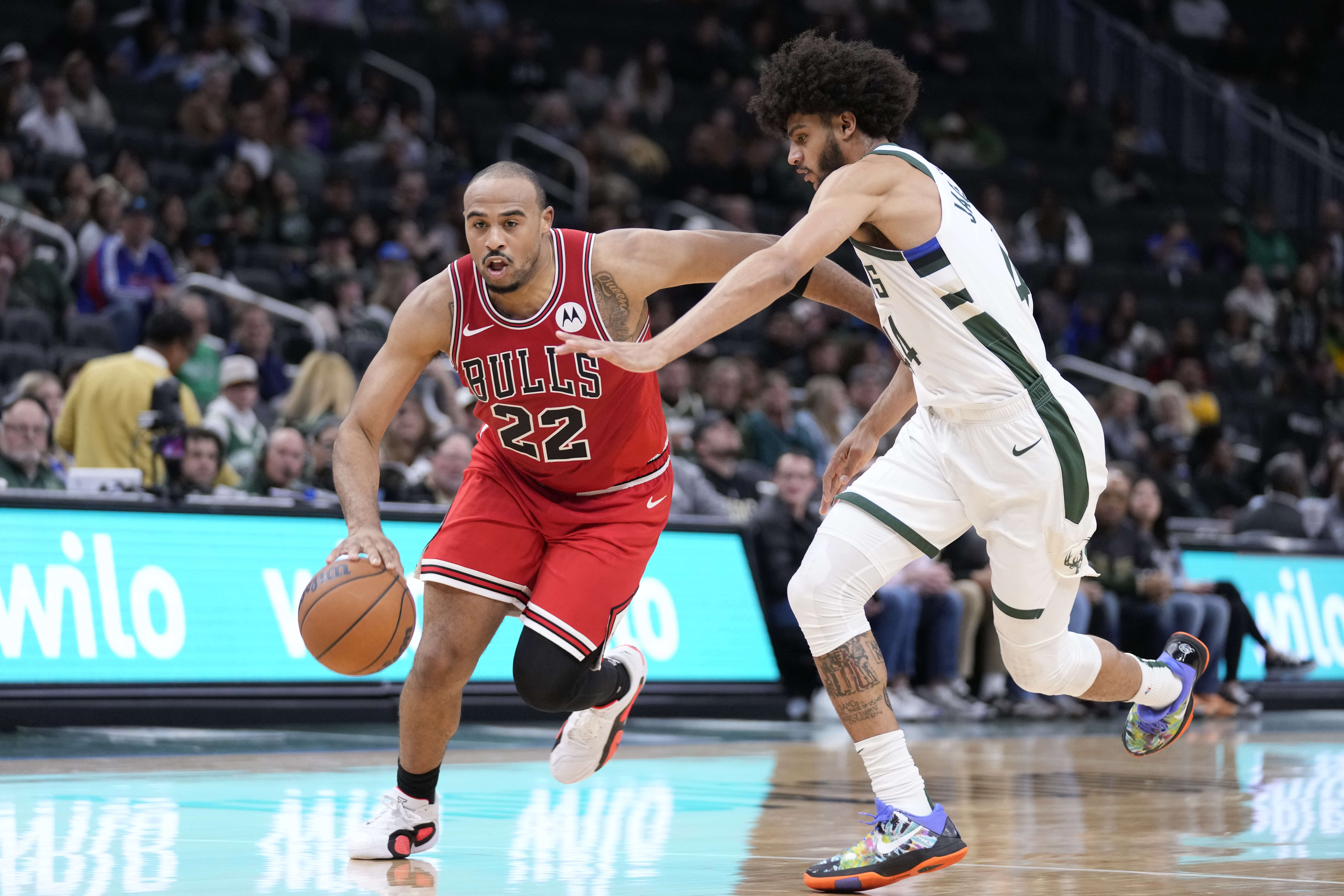 Chicago Bulls' Talen Horton-Tucker (22) dribbles the ball against the Milwaukee Bucks' Andre Jackson Jr. during the second half of an NBA preseason basketball game Monday, Oct. 14, 2024, in Milwaukee. 