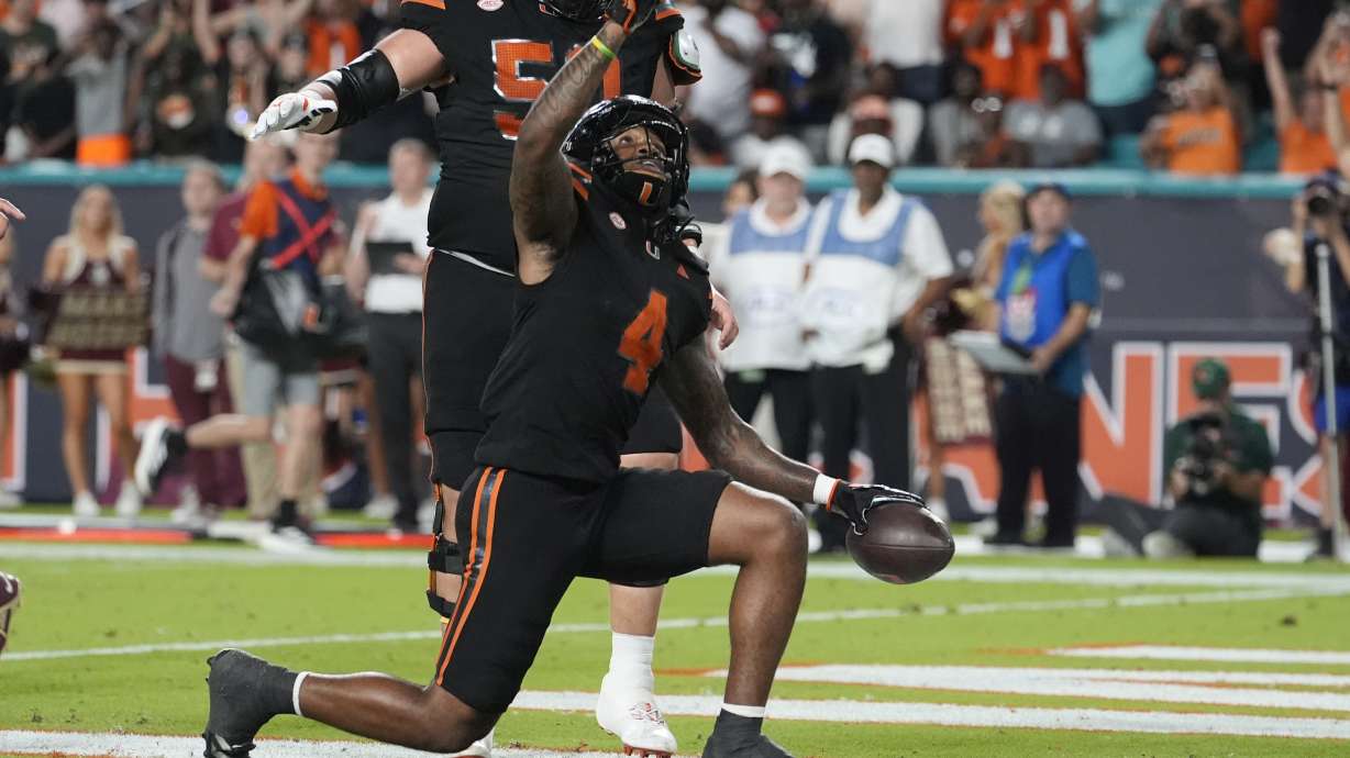 Miami running back Mark Fletcher Jr. (4) reacts after scoring a touchdown during the first half of an NCAA college football game against Florida State, Saturday, Oct. 26, 2024, in Miami Gardens, Fla.
