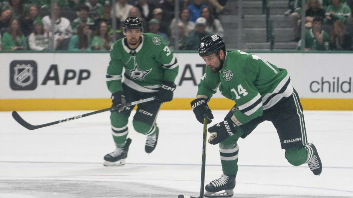 Dallas Stars left wing Jamie Benn (14) gains possession of the puck during the first period of an NHL hockey game against the Chicago Blackhawks, Saturday, Oct. 26, 2024, in Dallas.