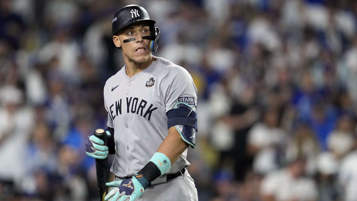 New York Yankees' Aaron Judge walks back to the dugout after striking out against the Los Angeles Dodgers during the ninth inning in Game 2 of the baseball World Series, Saturday, Oct. 26, 2024, in Los Angeles.