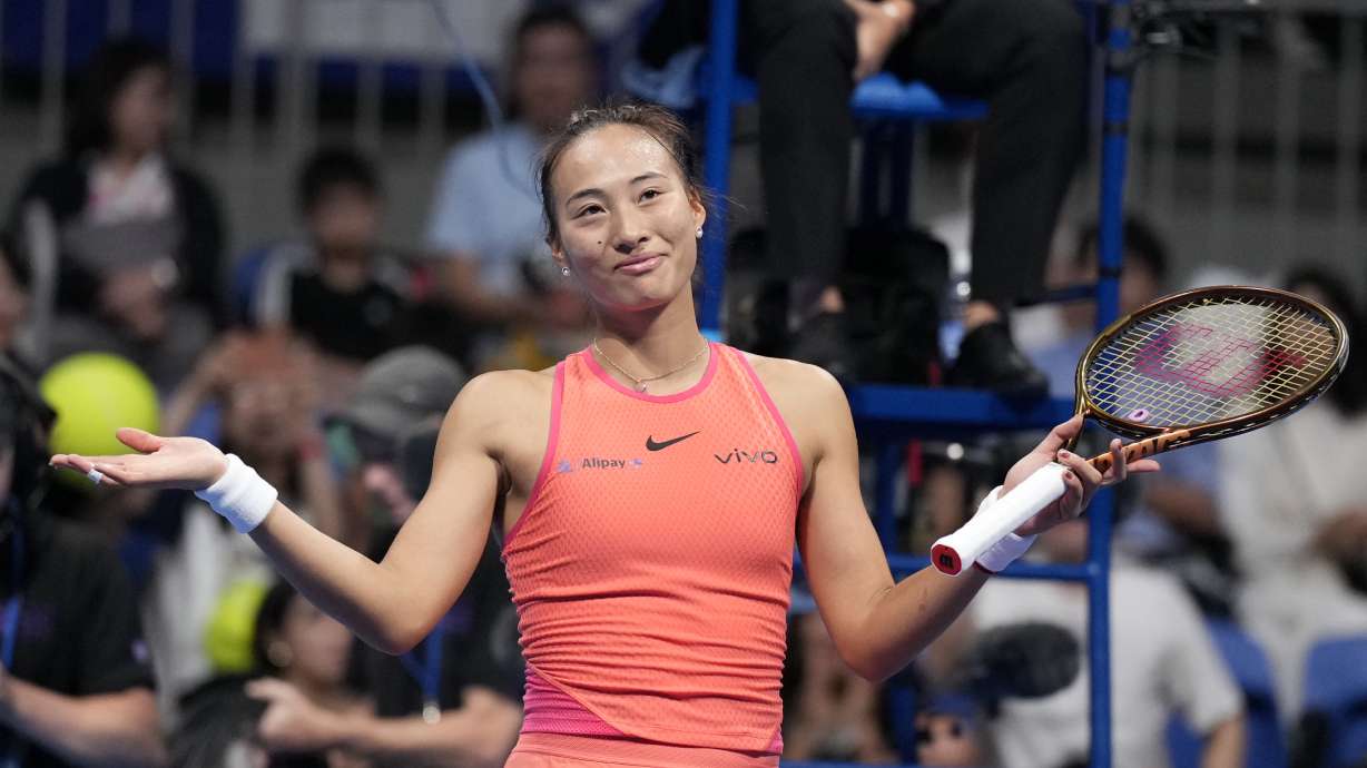 China's Zheng Qinwen gestures after winning against Sofia Kenin of the United States in the final match of the Pan Pacific Open women's tennis tournament at Ariake Coliseum, in Tokyo, Sunday, Oct. 27, 2024.