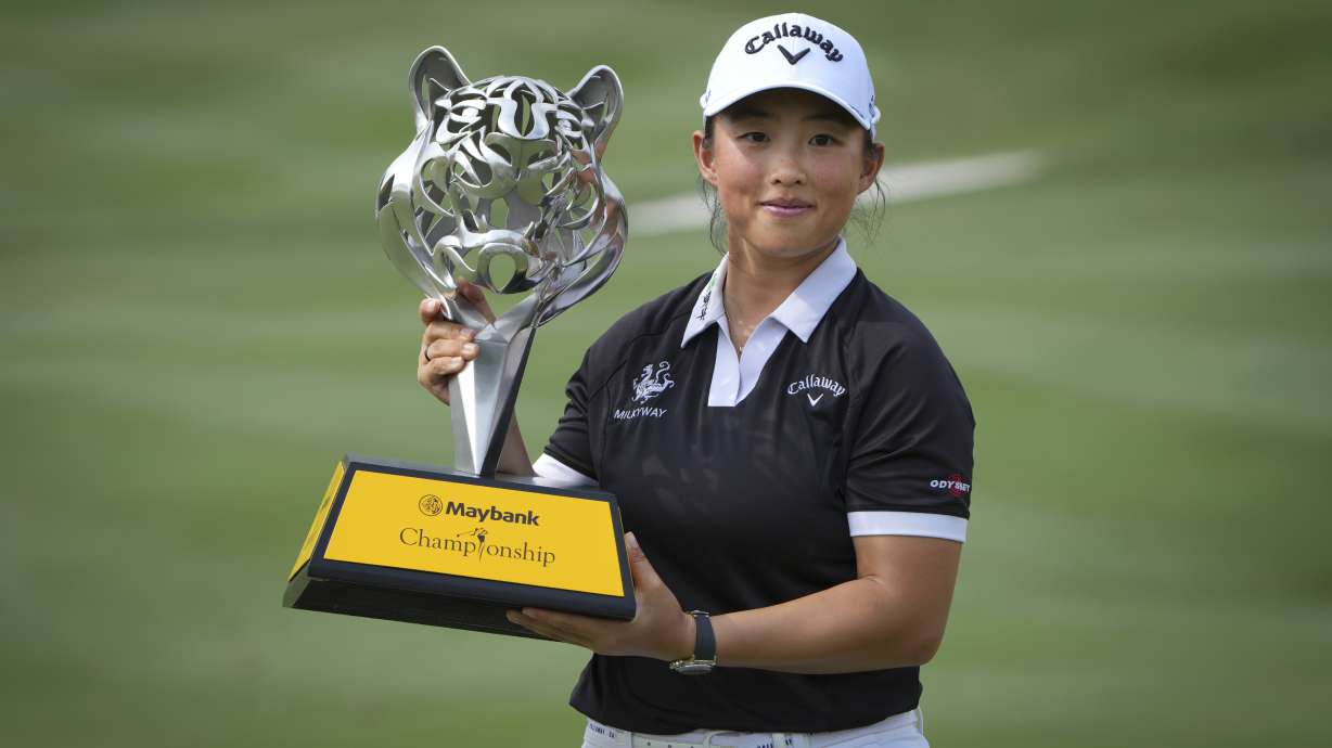 Yin Ruoning of China holds the winning trophy during the awards ceremony after winning the LPGA Tour's Maybank Championship at Kuala Lumpur Golf and Country club in Kuala Lumpur, Sunday, Oct. 27, 2024.