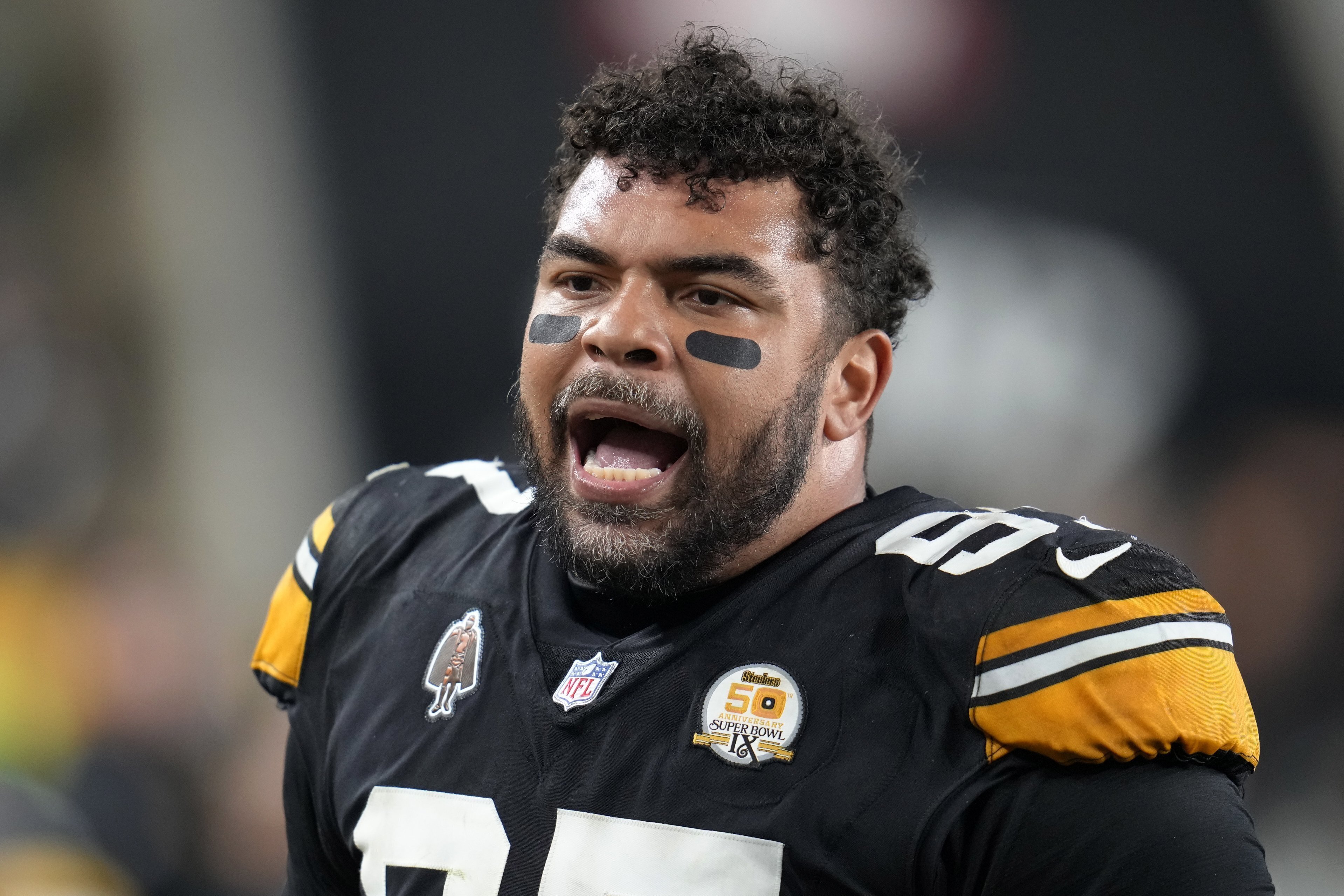 Pittsburgh Steelers defensive tackle Cameron Heyward (97) talks with teammates on the sidelines during the second half of an NFL football game against the New York Jets in Pittsburgh Sunday, Oct. 20, 2024.