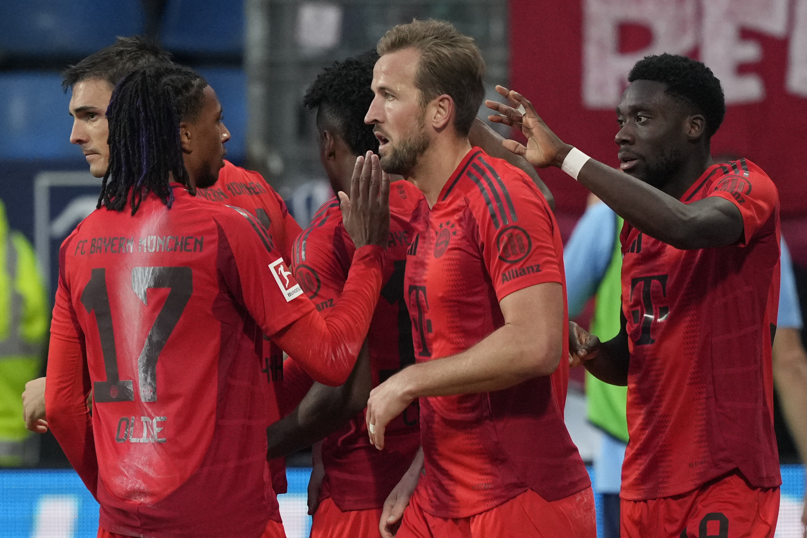 Bayern players celebrate after a goal during the German Bundesliga soccer match between VfL Bochum and Bayern Munich in Bochum, Germany, Sunday, Oct. 27, 2024. 