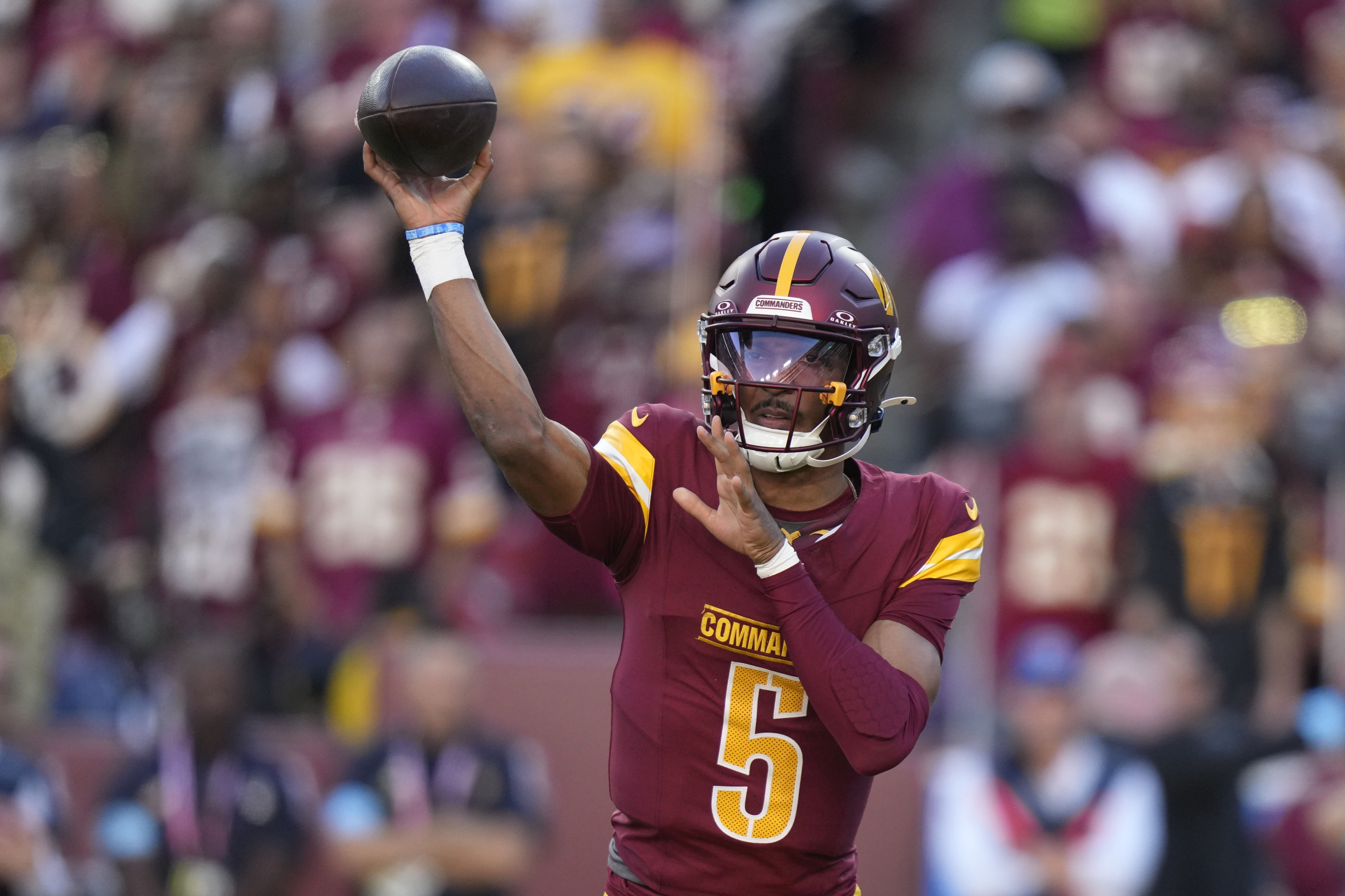 Washington Commanders quarterback Jayden Daniels throws a pass during the first half of an NFL football game against the Carolina Panthers, Sunday, Oct. 20, 2024, in Landover, Md. 